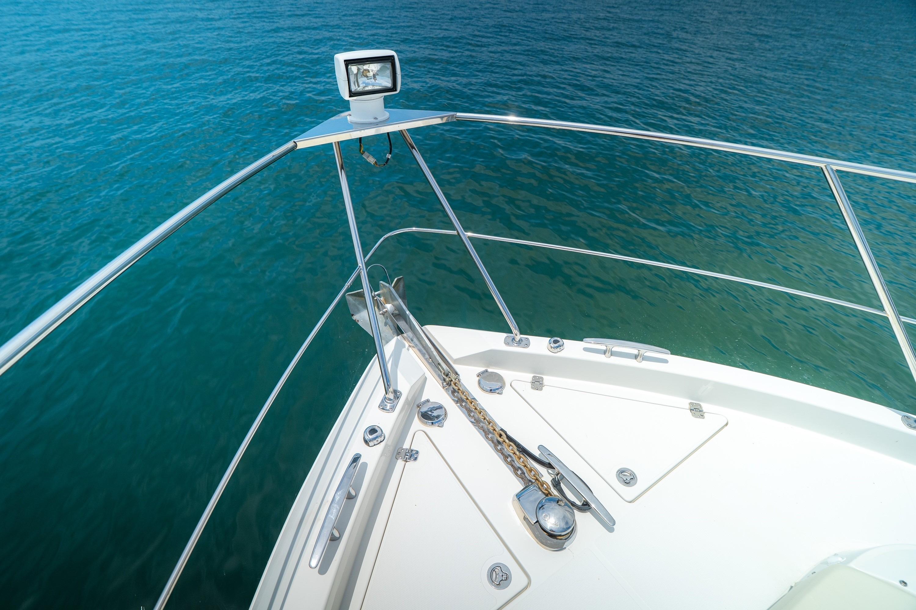 Bow of 2011 Carver 44 Sojourn yacht with anchor chain and ocean view.