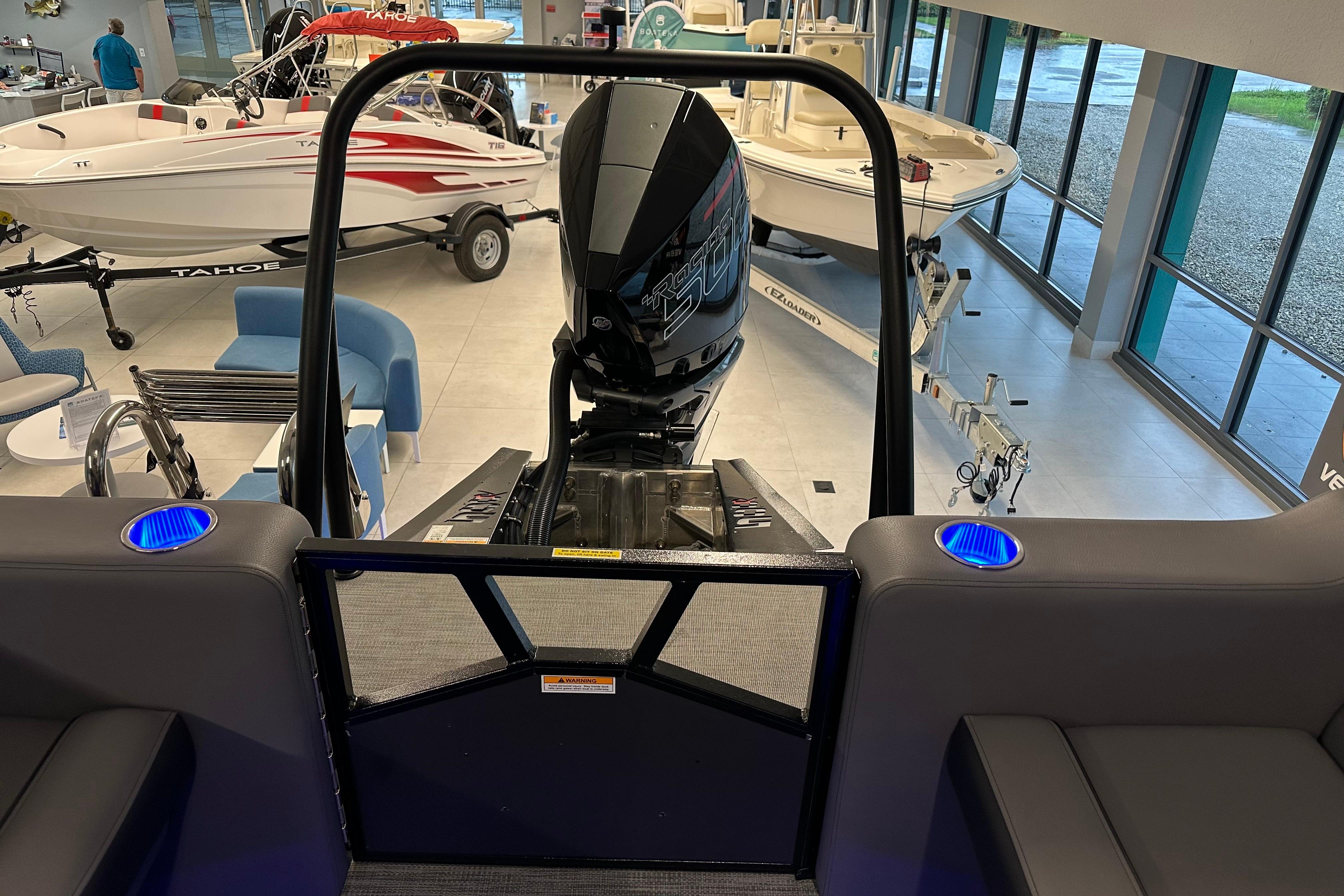 2025 Veranda VX 27 DCRC boat interior with motor, showroom display.