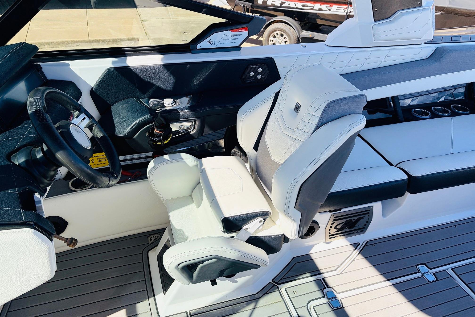 2023 Nautique Super Air Nautique G25 interior with steering wheel and seating.
