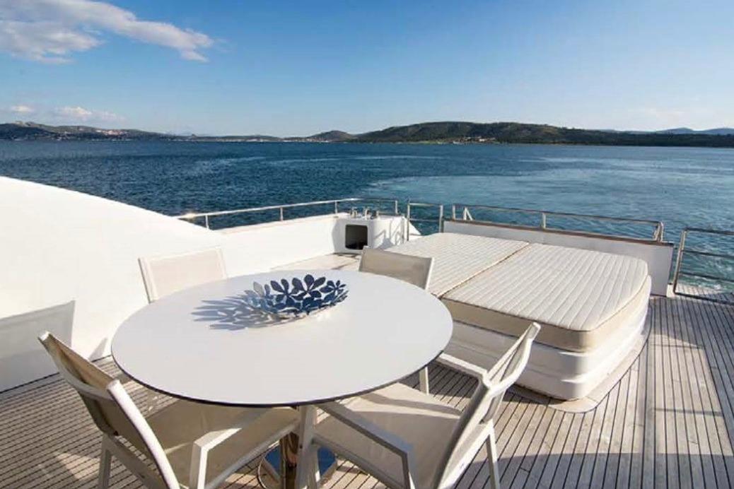Luxury yacht Tecnomar Velvet 26 deck with seating, ocean view, 2005 model.