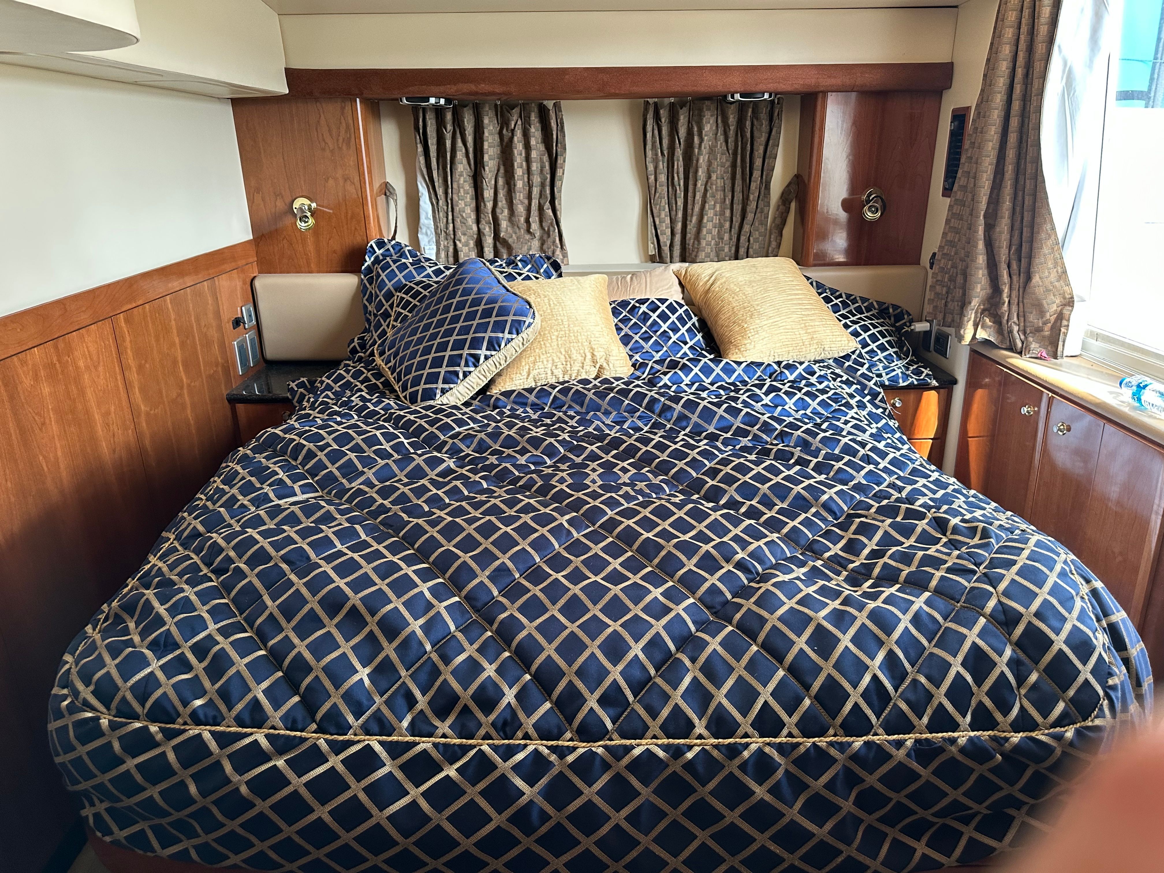 Luxurious bedroom in a 2007 Meridian 459 Motoryacht.