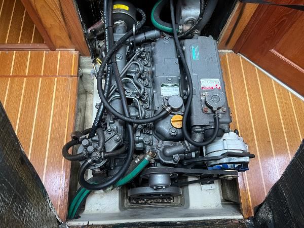 Engine compartment of a 2000 Hunter 410 with visible engine and hoses.