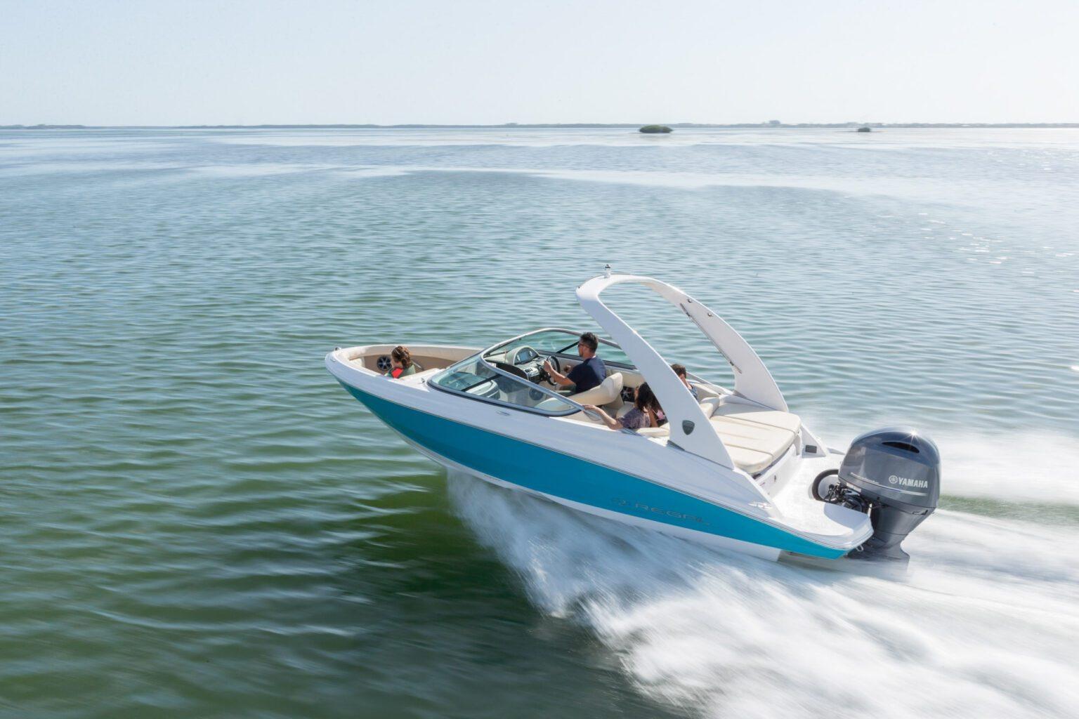 2026 Regal 21 OBX boat cruising on open water, featuring a sleek design and Yamaha outboard motor.