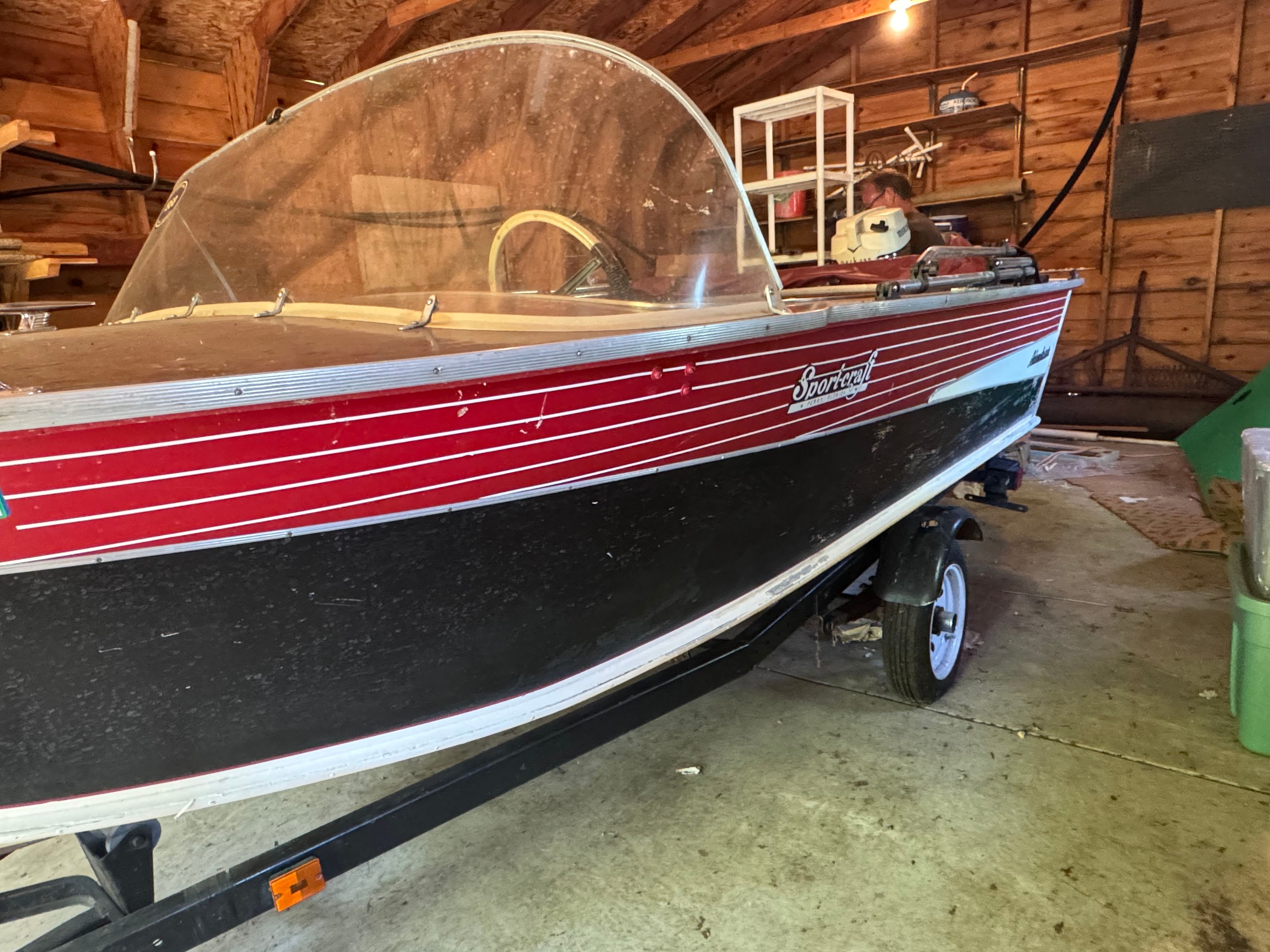 1958 Sportcraft Classic Runabout boat in a garage.