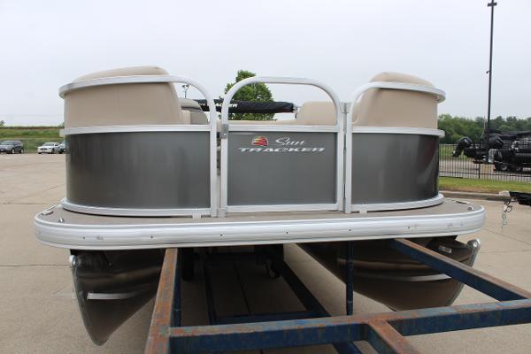 2025 Sun Tracker Party Barge 18 DLX pontoon boat on trailer.