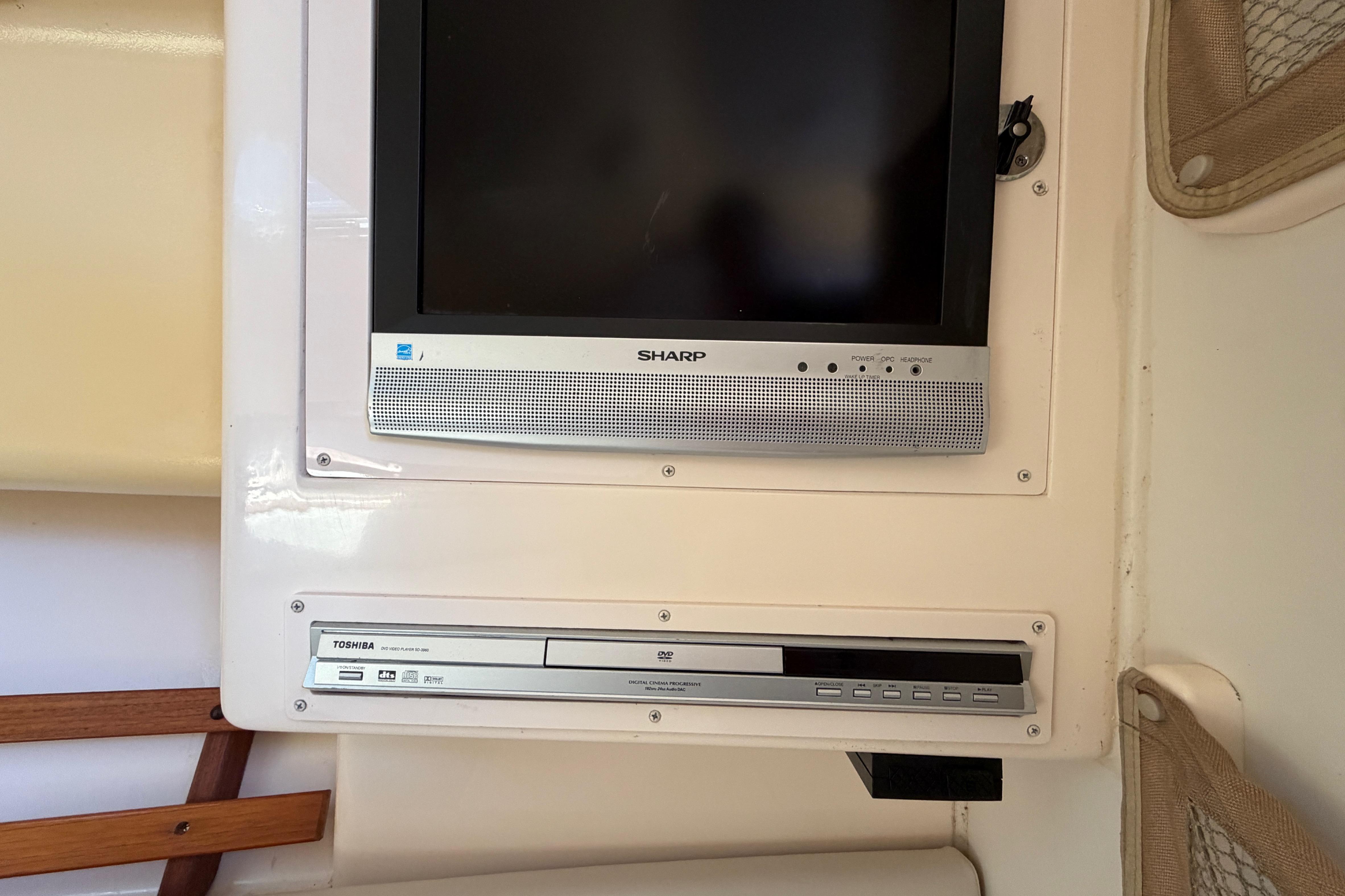 Sharp TV and Toshiba DVD player inside 2006 Grady-White Sailfish 282 boat cabin.