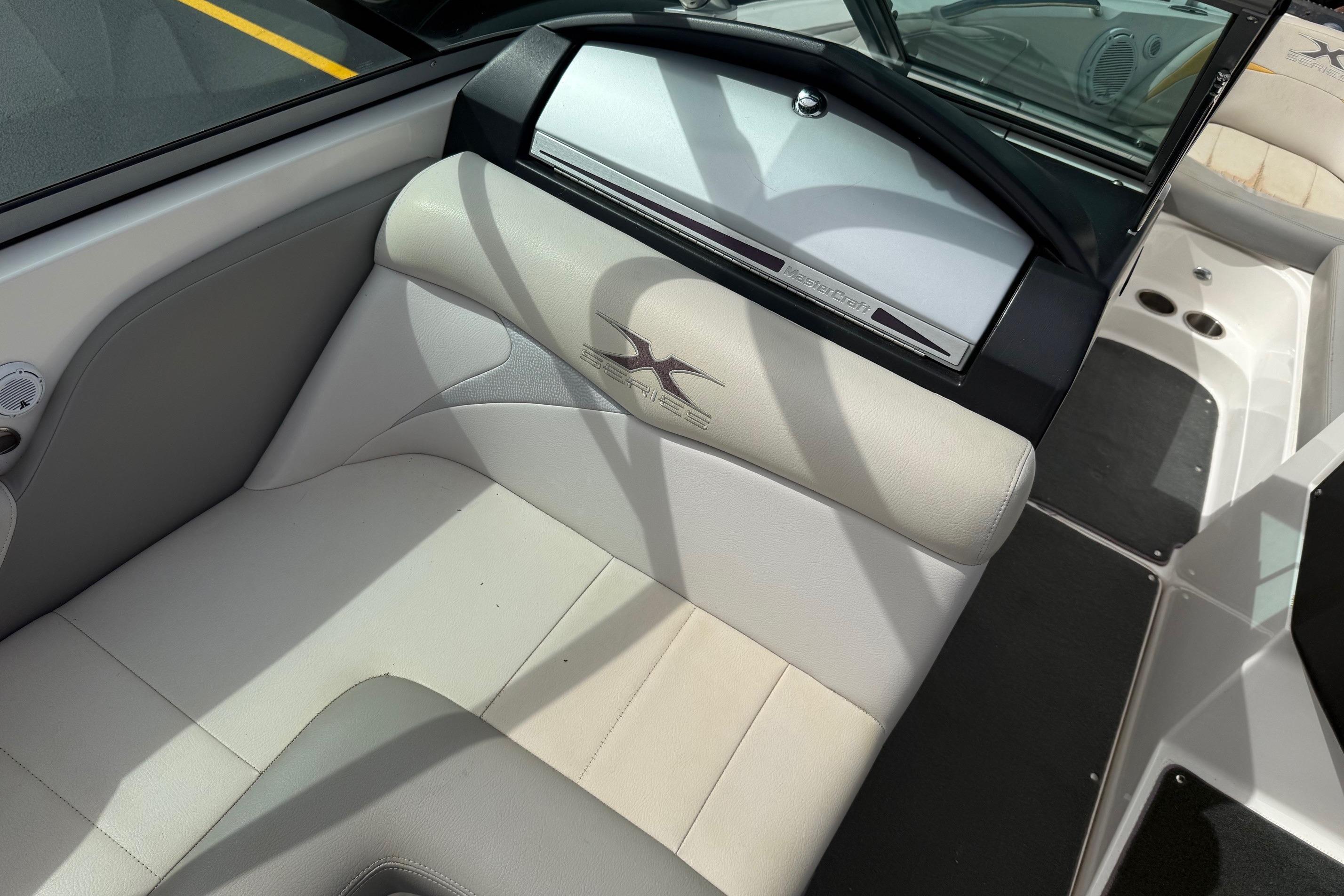 2008 MasterCraft X-15 boat interior with white and gray seating.