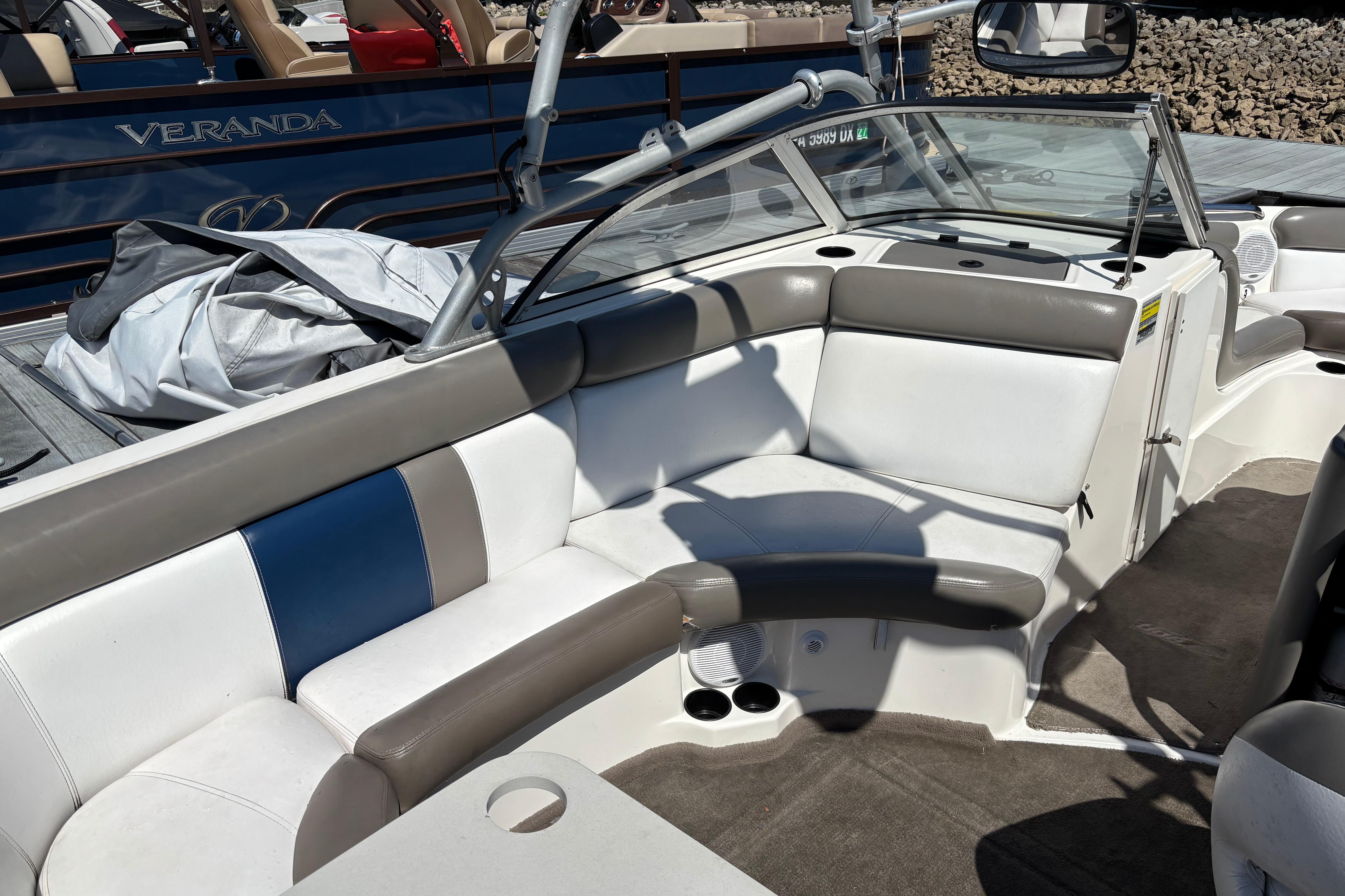 2004 Tigé 22V Limited Edition boat interior with cushioned seating and sleek design.