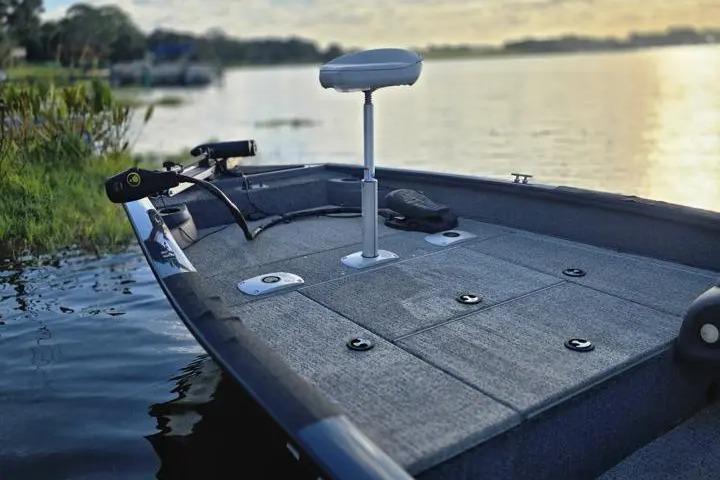 2020 Tracker Pro Team 175 TF boat on a serene lake at sunset.