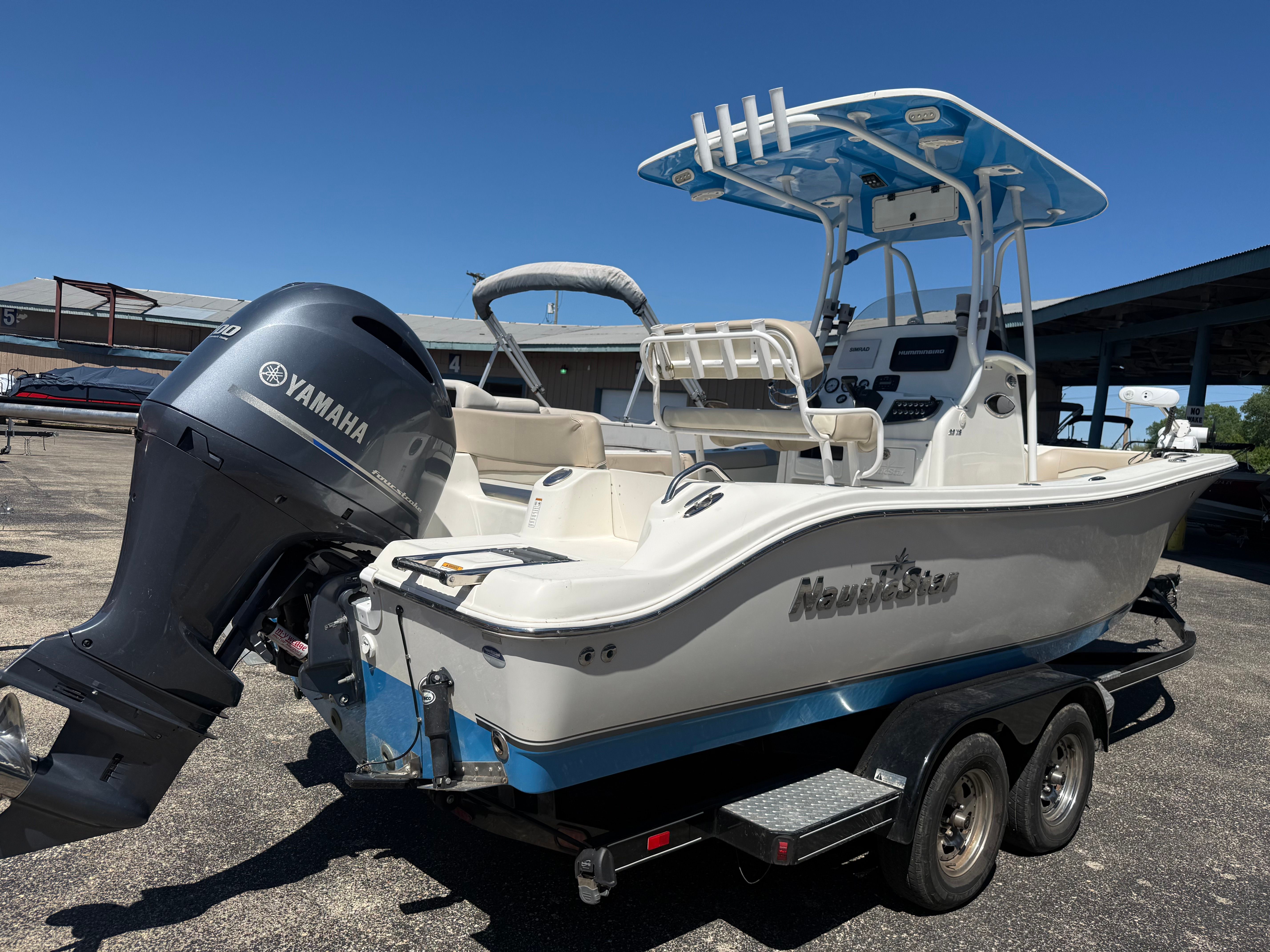A NauticStar 22 XS boat on a trailer, featuring a Yamaha outboard motor.
