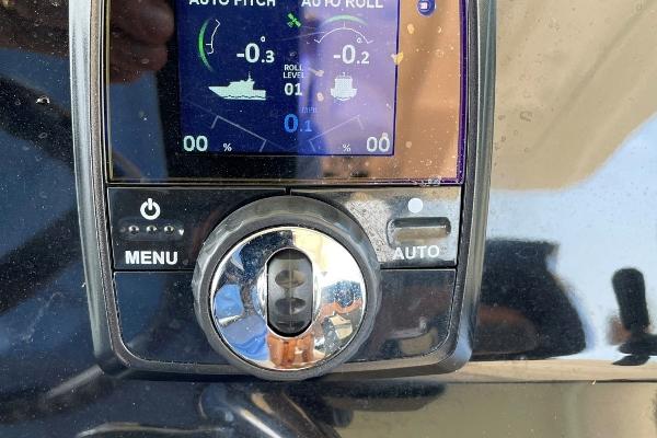 Control panel of a 2020 Scout 420 LXF boat displaying auto pitch and roll settings.