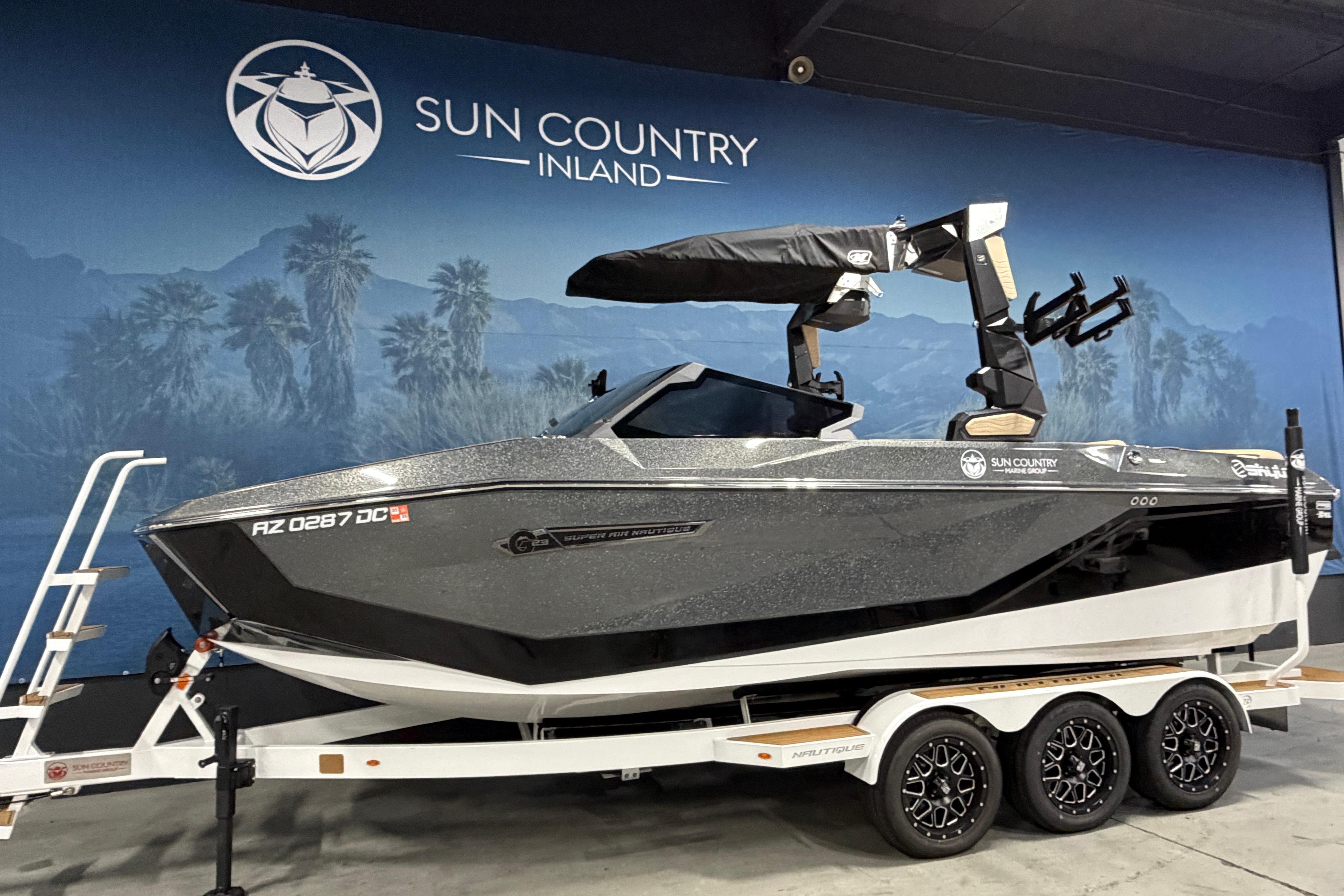 2025 Nautique Super Air Nautique G23 boat on trailer at Sun Country Inland showroom.