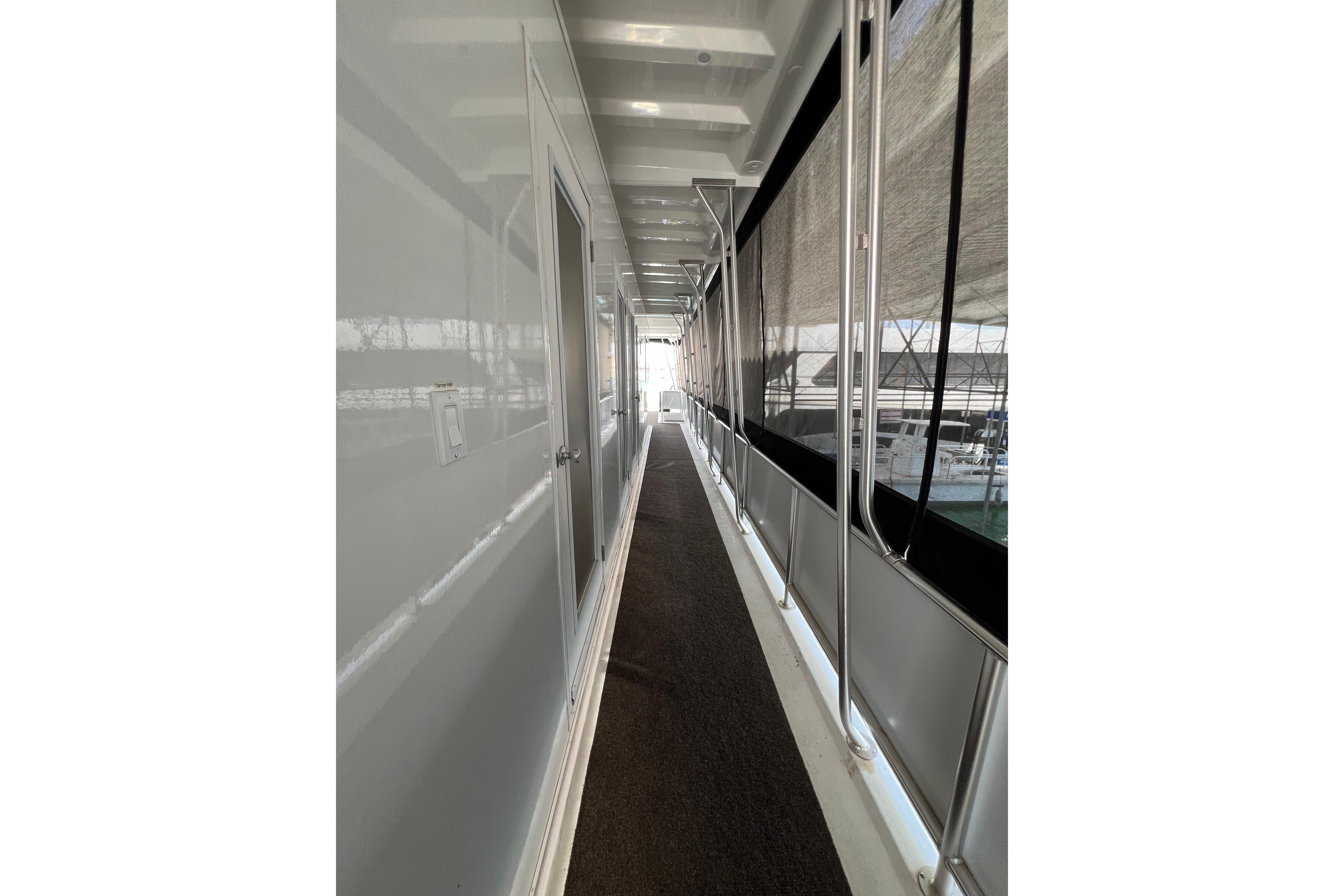 Narrow corridor on 2025 Sumerset Excellence Multiple Shares houseboat, featuring sleek design and modern finishes.