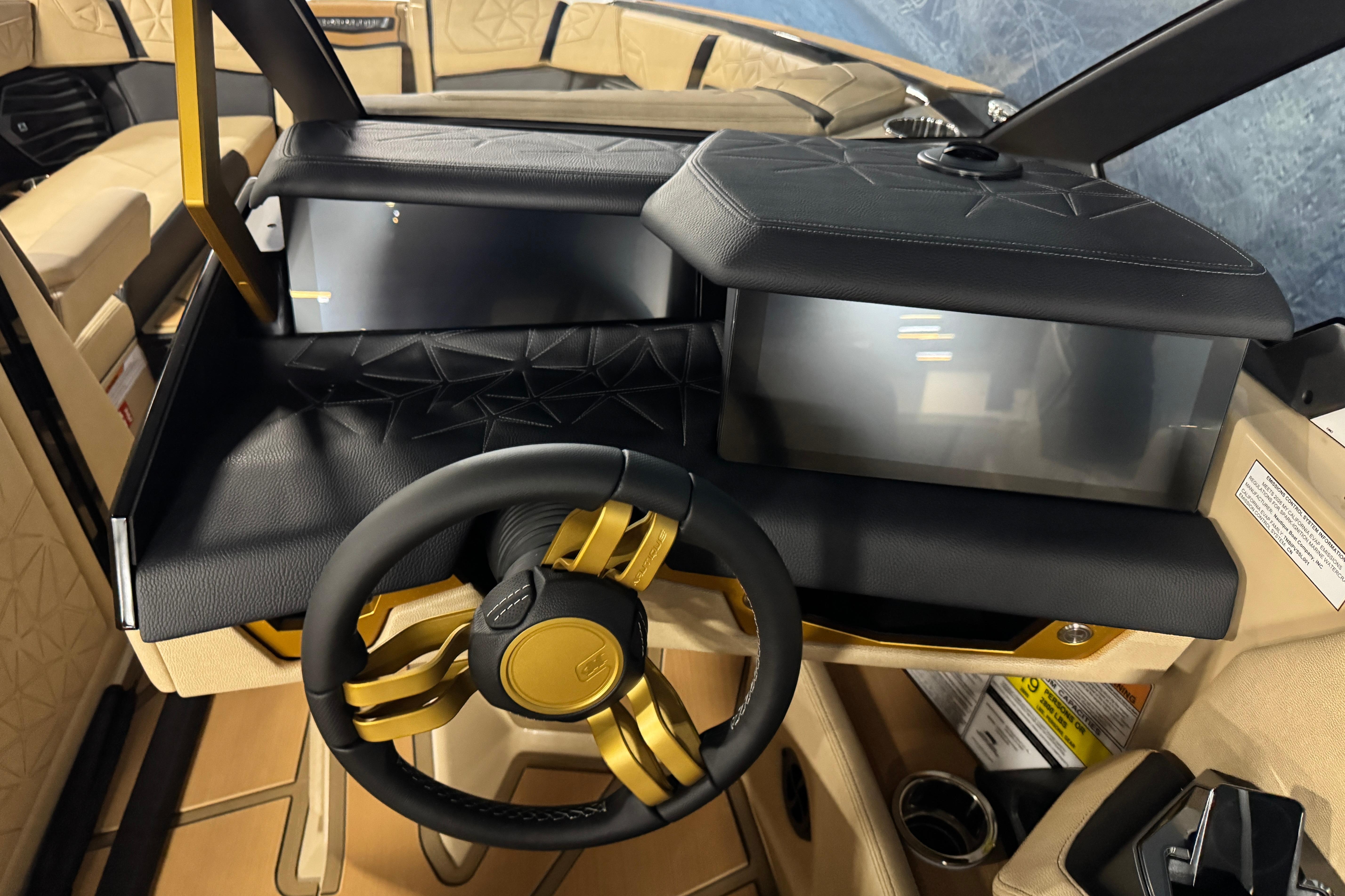 Interior of 2026 Nautique Super Air Nautique G25 Paragon with luxurious steering wheel design.