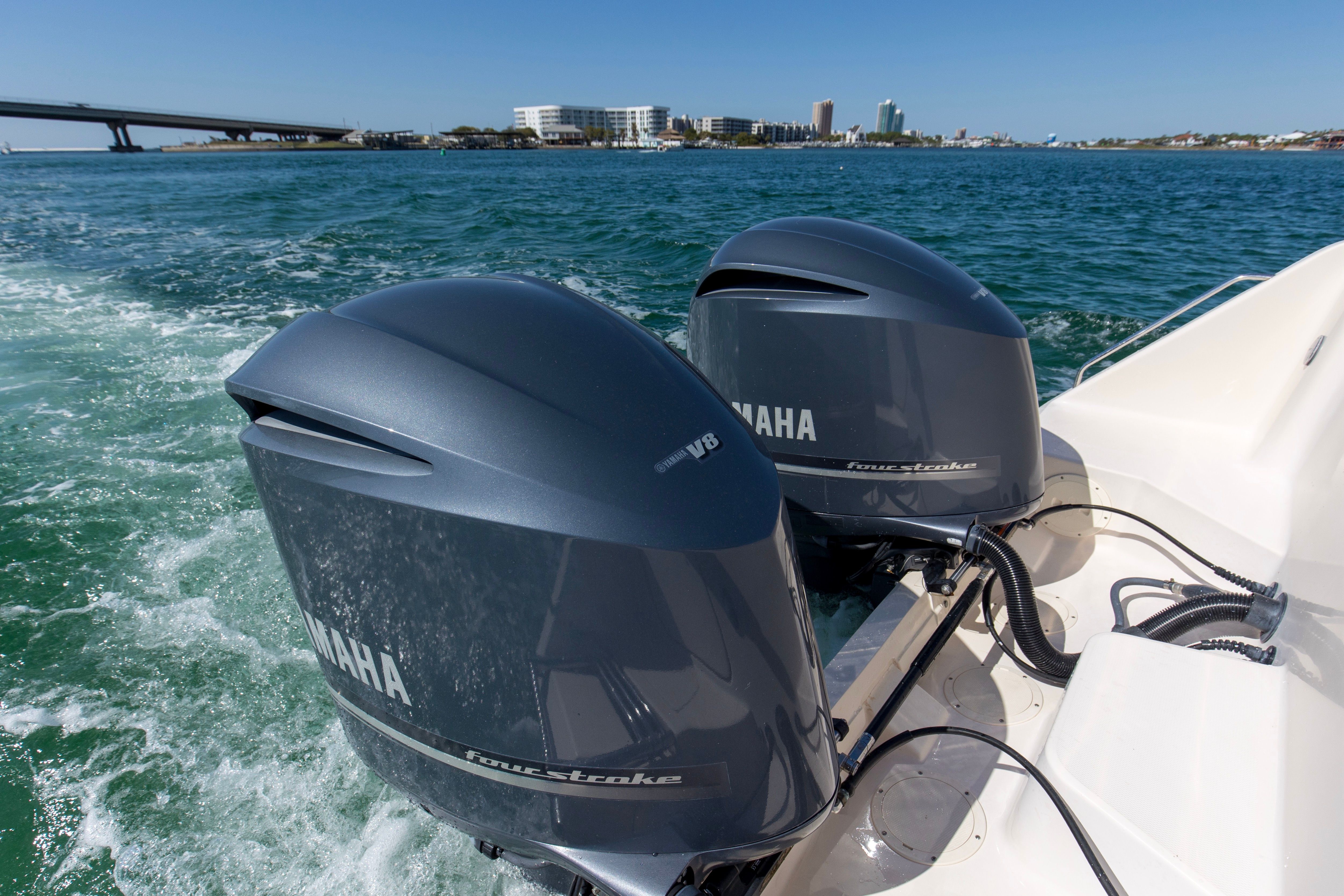 Grady-White Express 330 boat with Yamaha engines on water.