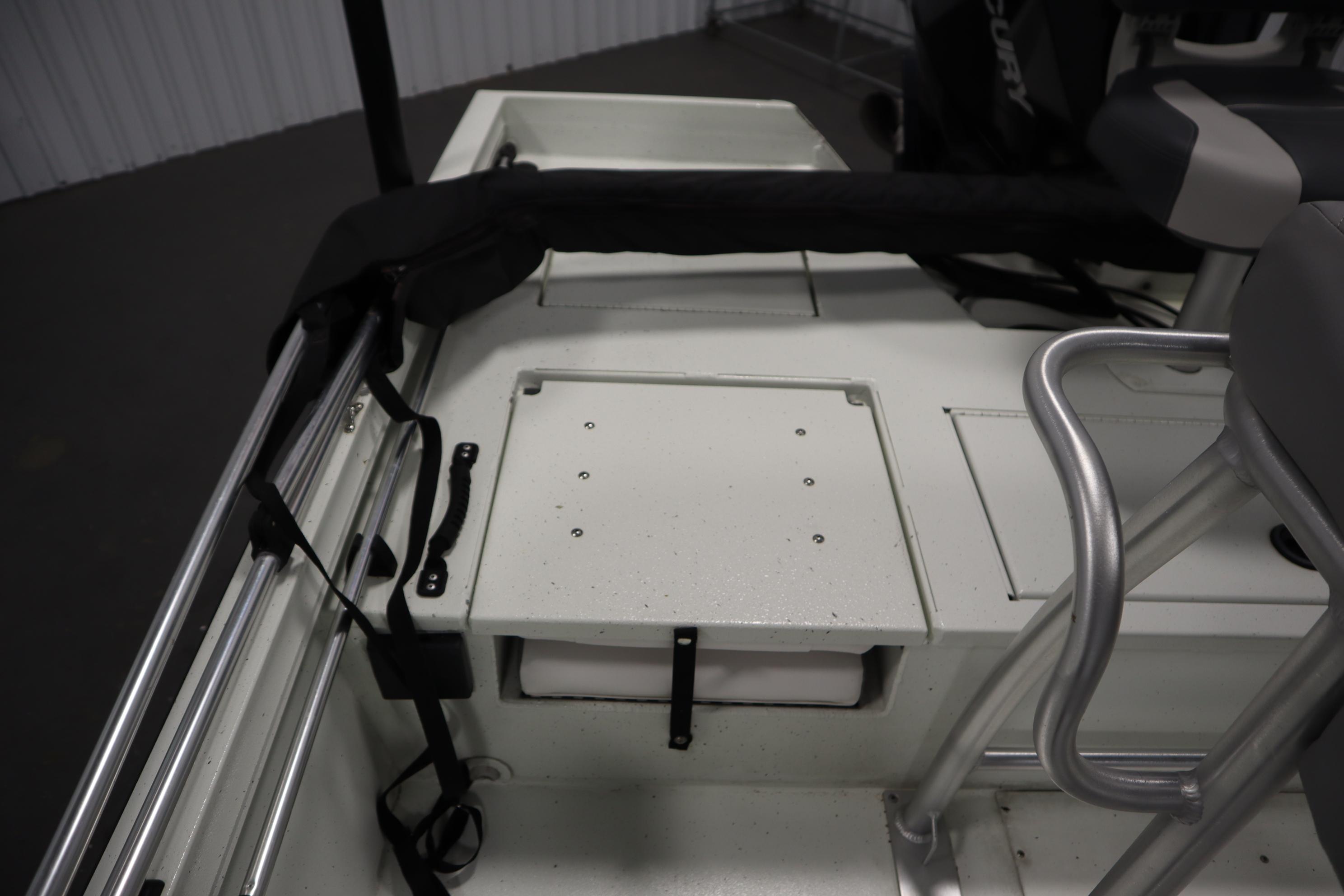 2022 Crestliner 2200 CC boat interior with storage compartment and seating area.