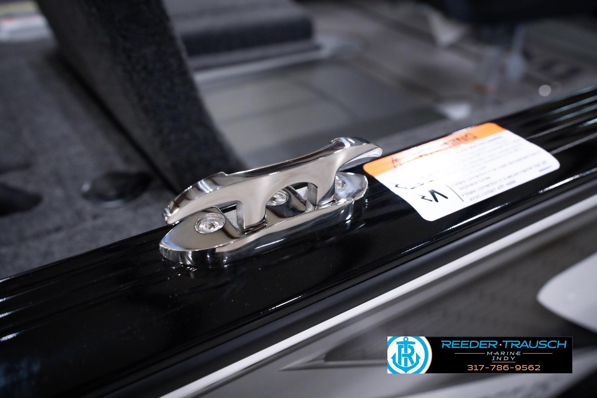 2026 Lund 1875 Impact XS SS boat cleat detail with Reeder Trausch Marine logo.