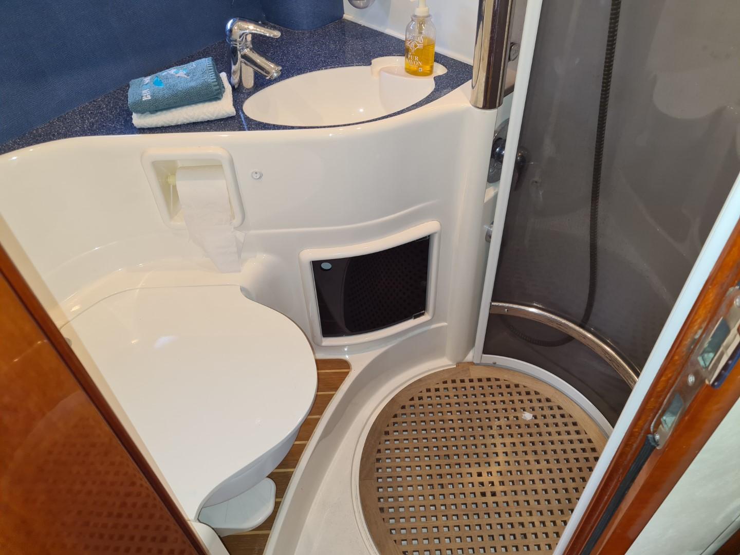 Bathroom interior of 2004 Fairline Targa 43 yacht with sink, toilet, and shower.