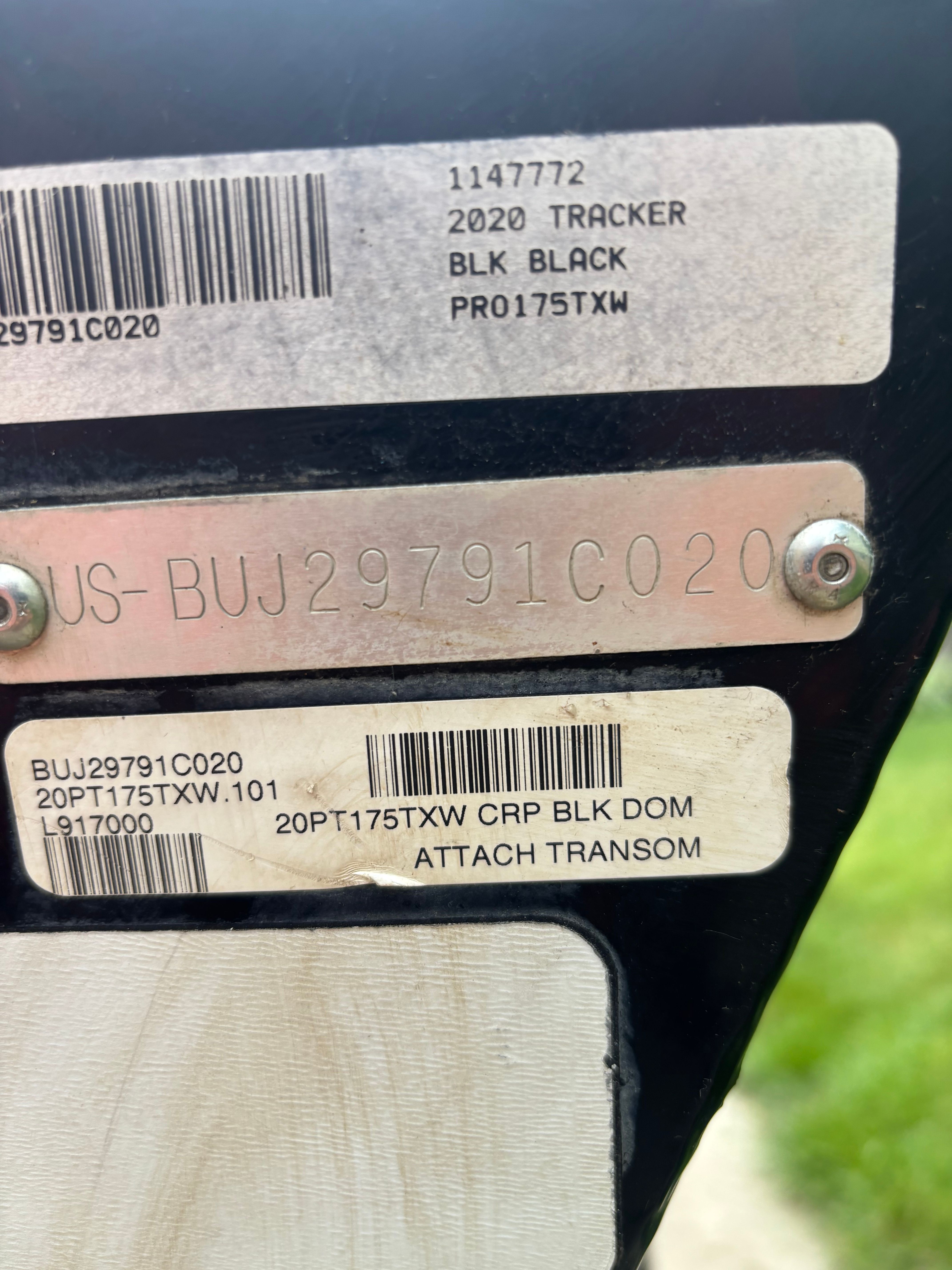 Close-up of serial numbers and labels on a boat.