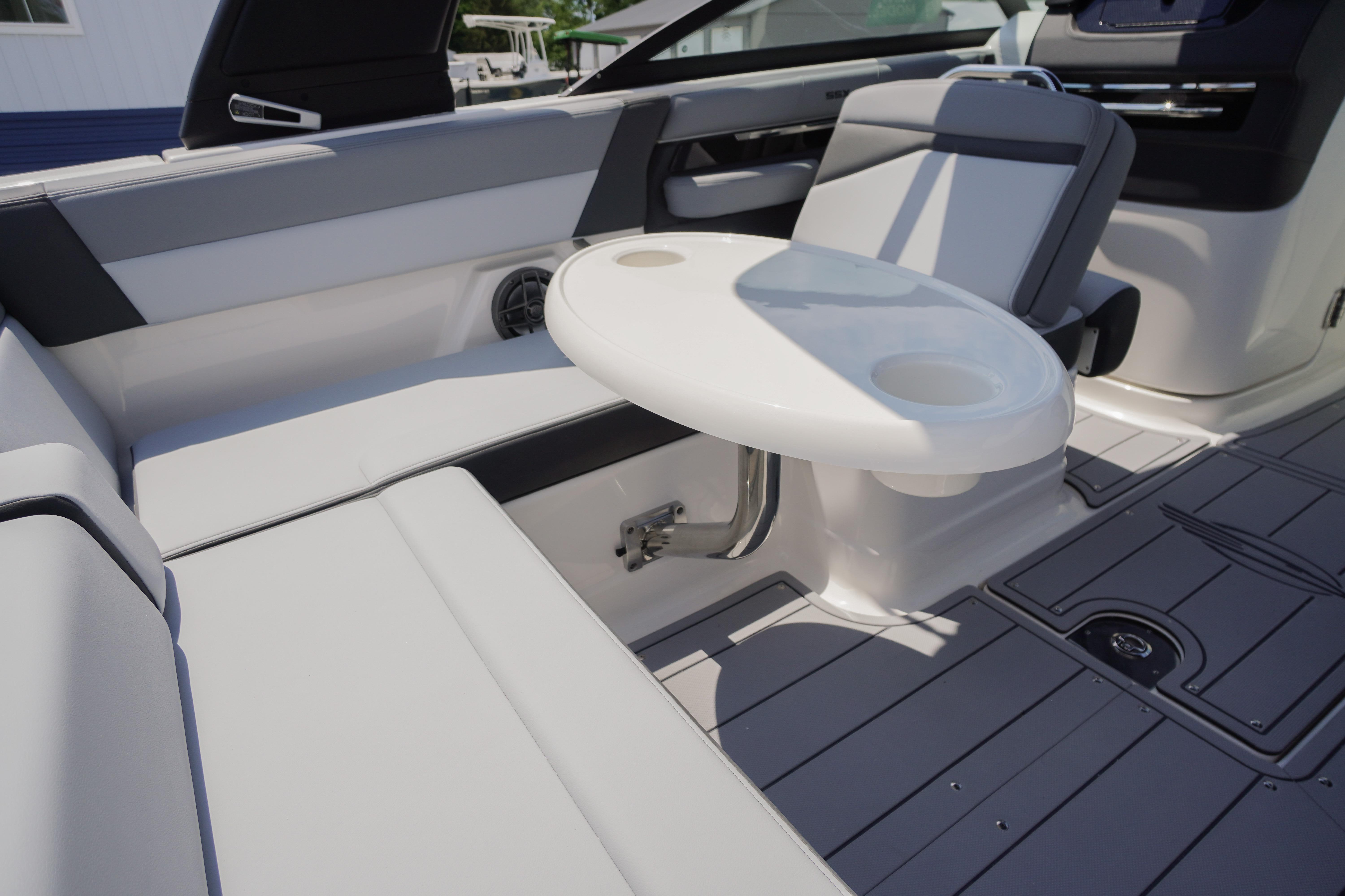 2026 Chaparral SSX 4 boat interior with seating and a round table.