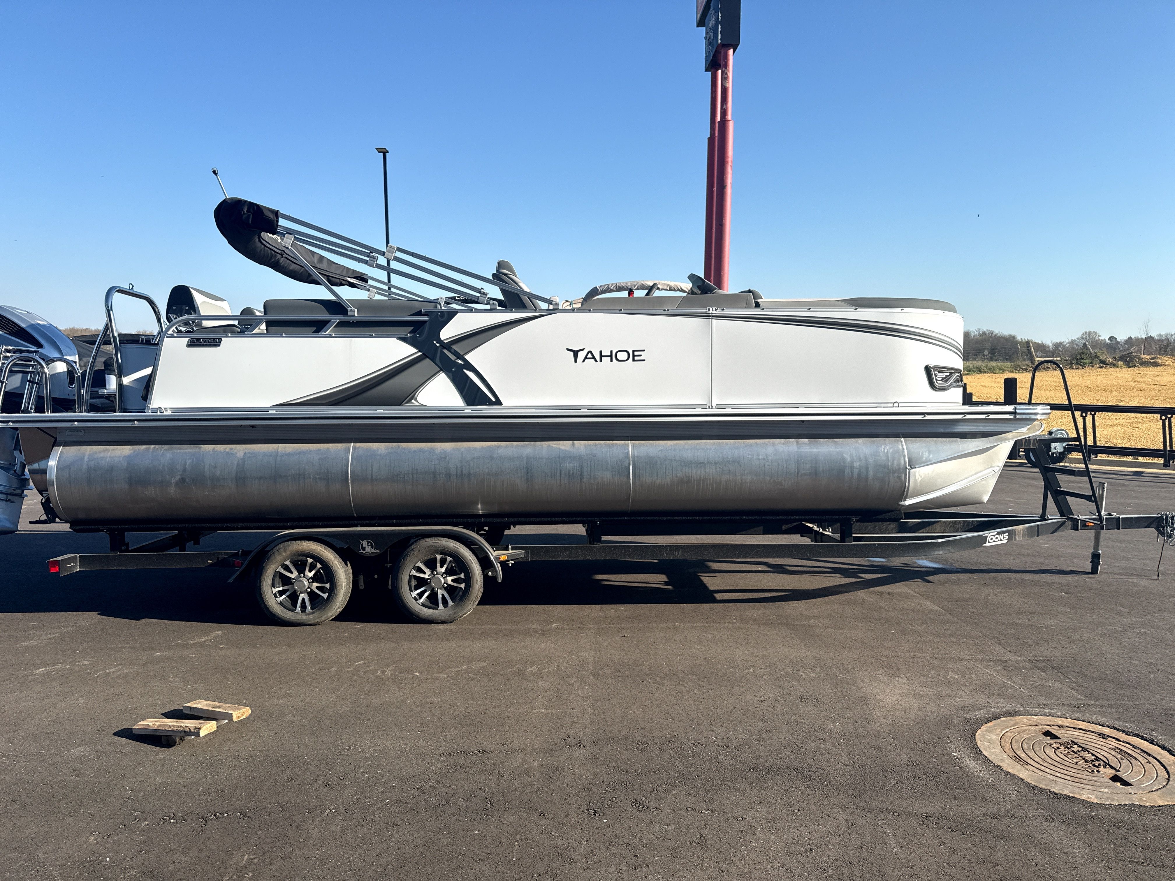 2026 Tahoe LTZ Quad Lounge Shift pontoon boat on trailer.
