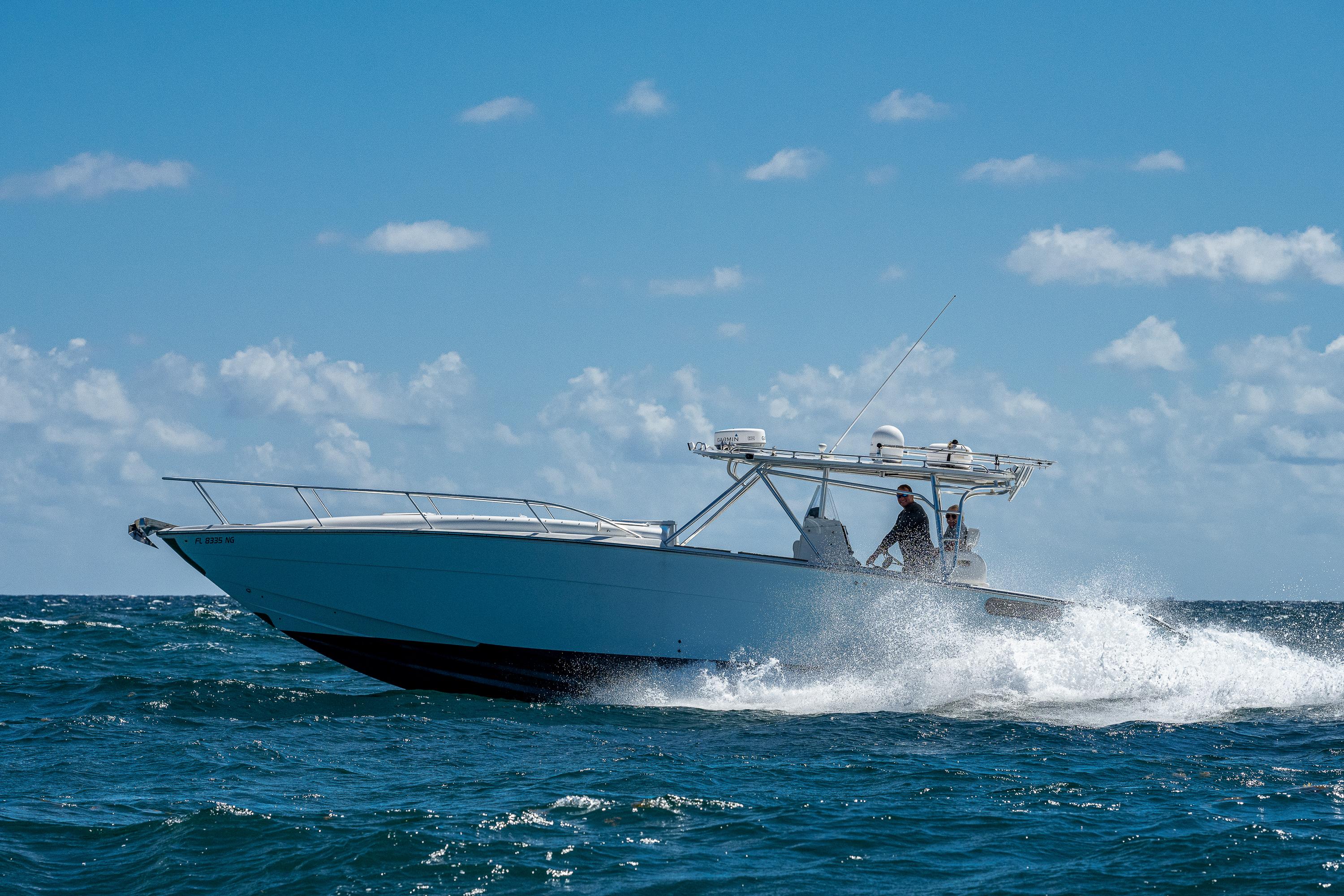 2007 Marlin Yachts 42 cruising on open water under a clear blue sky.