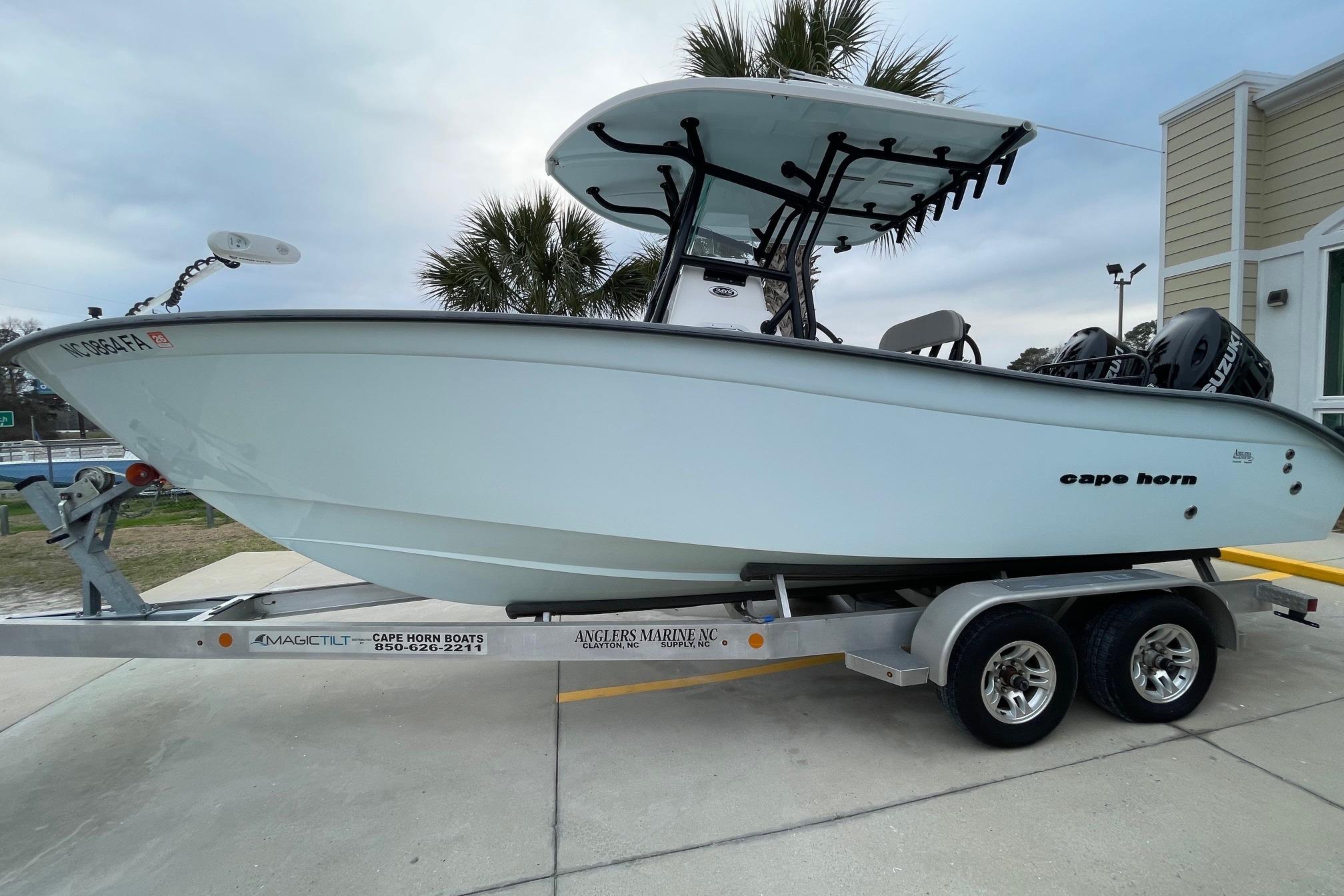 2023 Cape Horn 24 XS boat on trailer, parked outdoors near palm trees.