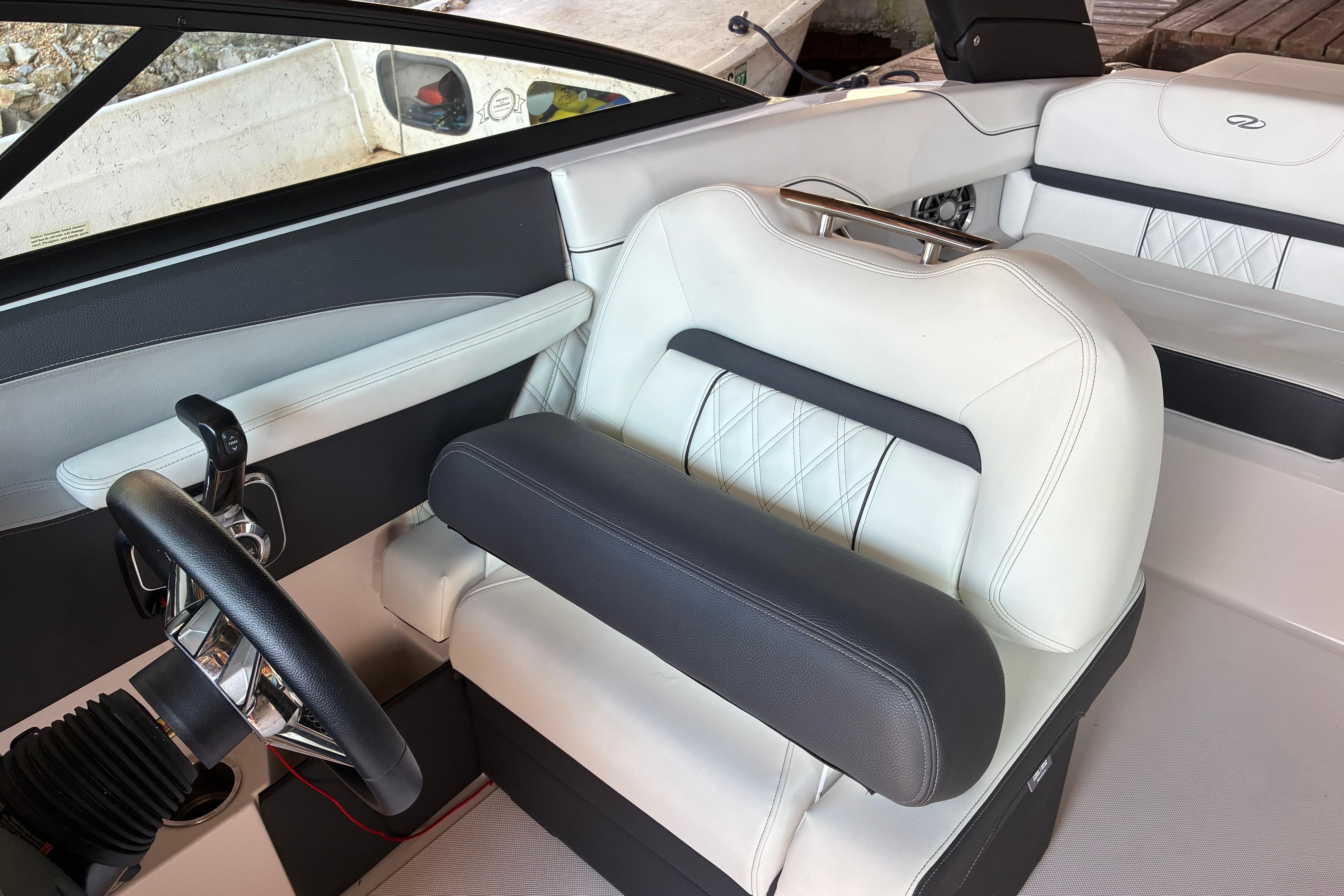Interior of 2025 Regal LS2 boat with luxurious white and black seating.