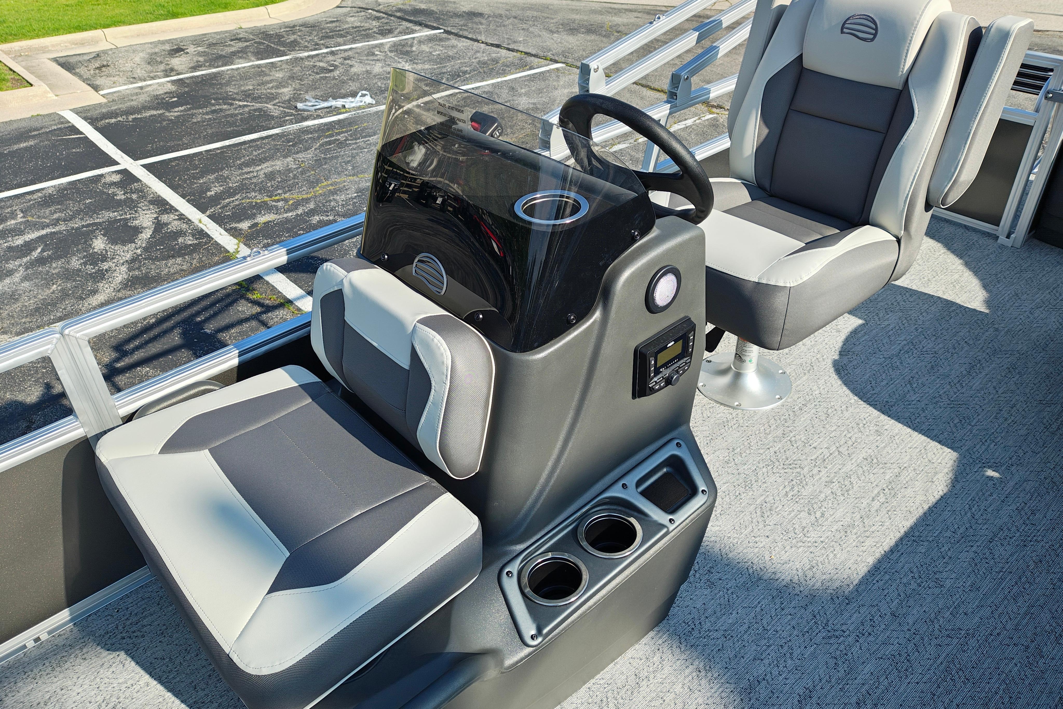 2026 Sun Tracker Bass Buggy 18 DLX boat interior with steering console and seating.