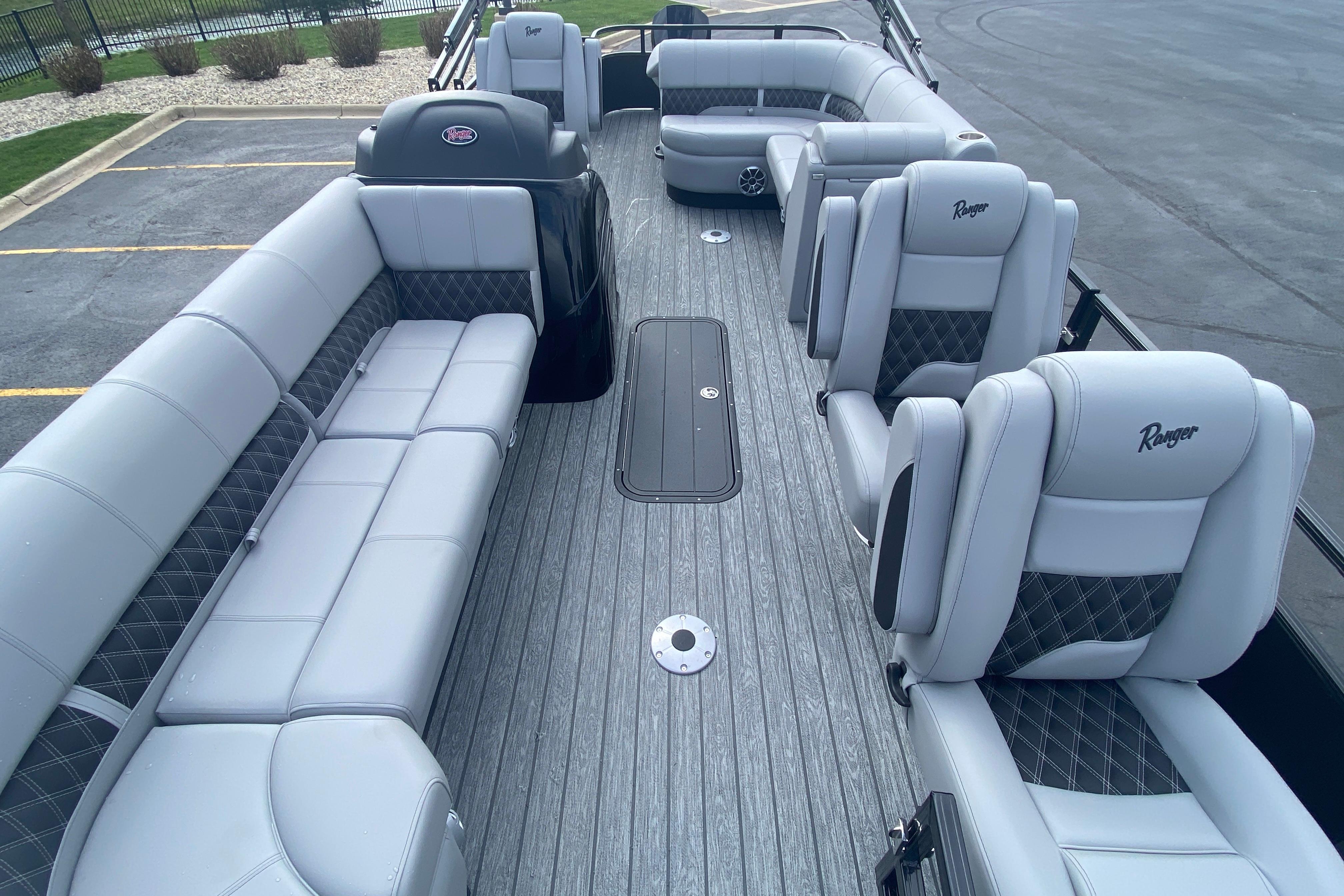 2026 Ranger 223FC boat interior with gray seating and spacious layout.