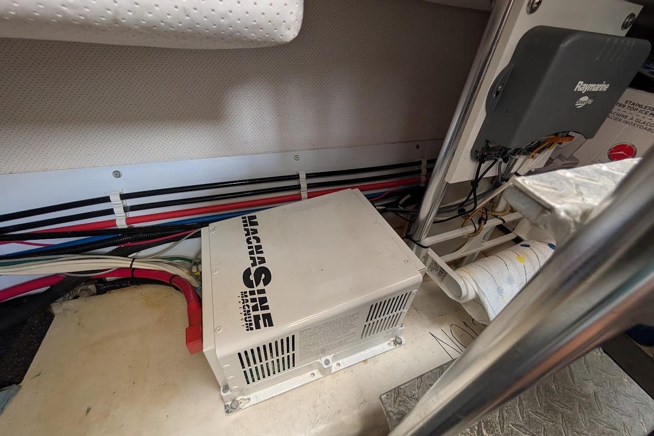 Electrical components and wiring inside a 2008 Mainship 38 boat, featuring a Magnum inverter.