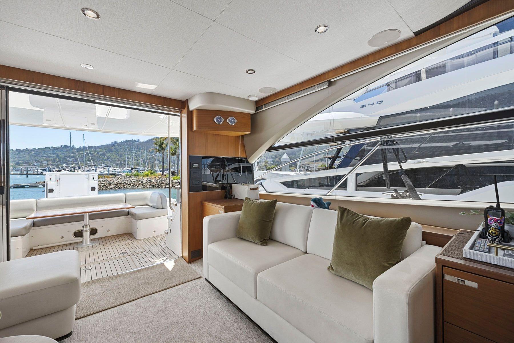 Interior of 2015 Princess 60 Flybridge Motor Yacht with marina view.