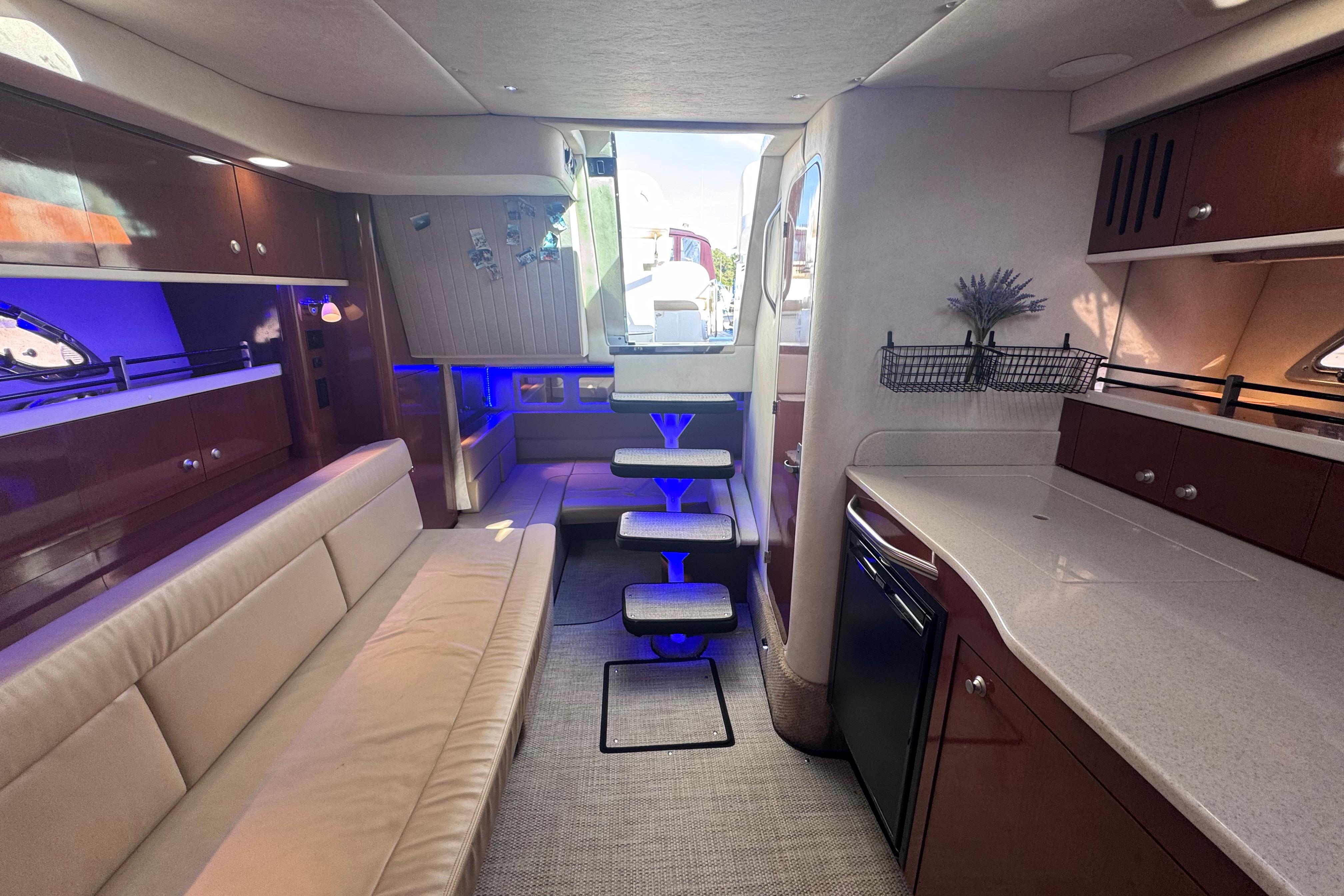 Luxurious interior of 2008 Sea Ray 350 Sundancer yacht with modern seating and ambient lighting.