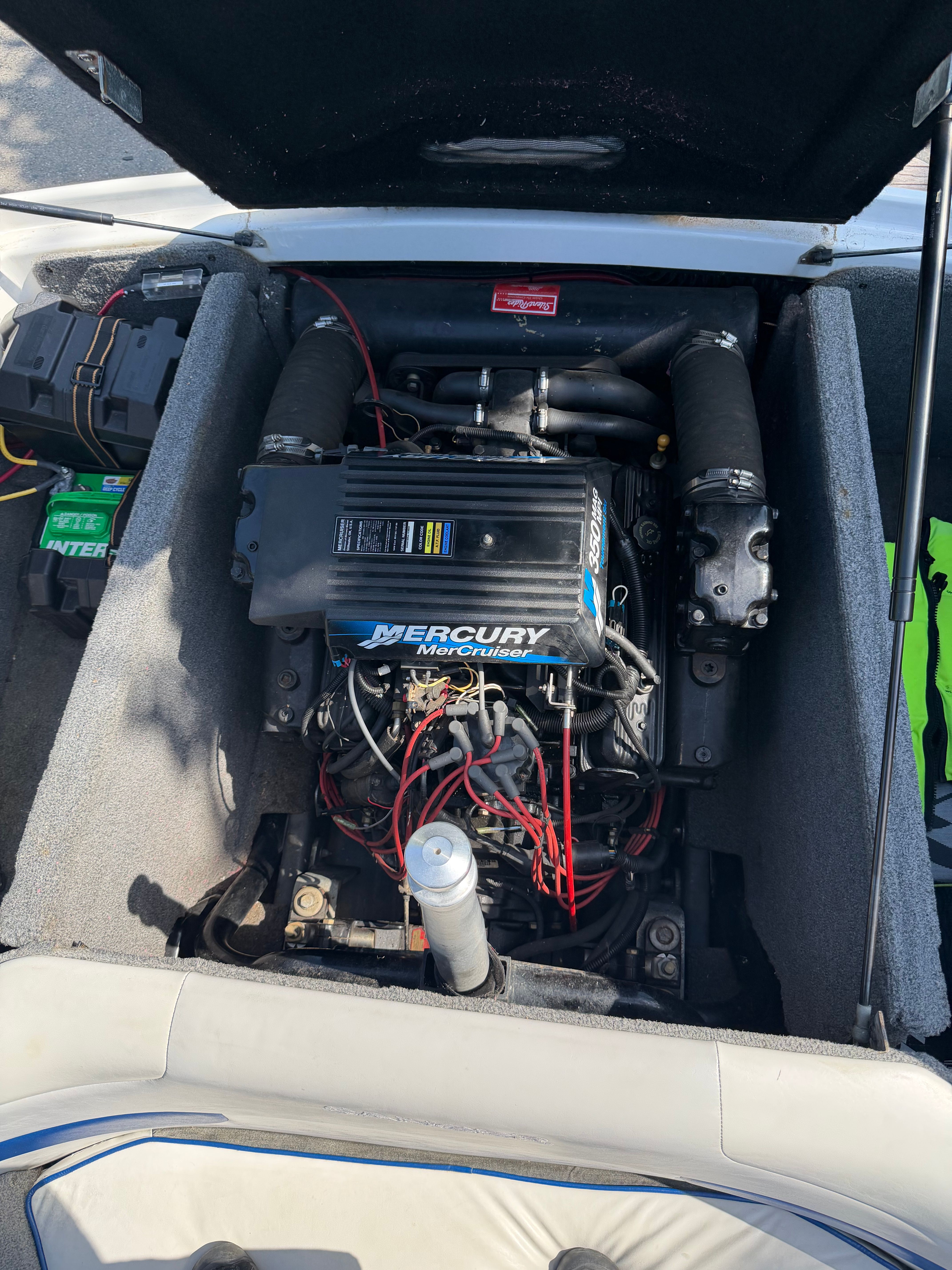 The engine compartment of a 2001 Sanger V210 with a Mercury engine is visible.