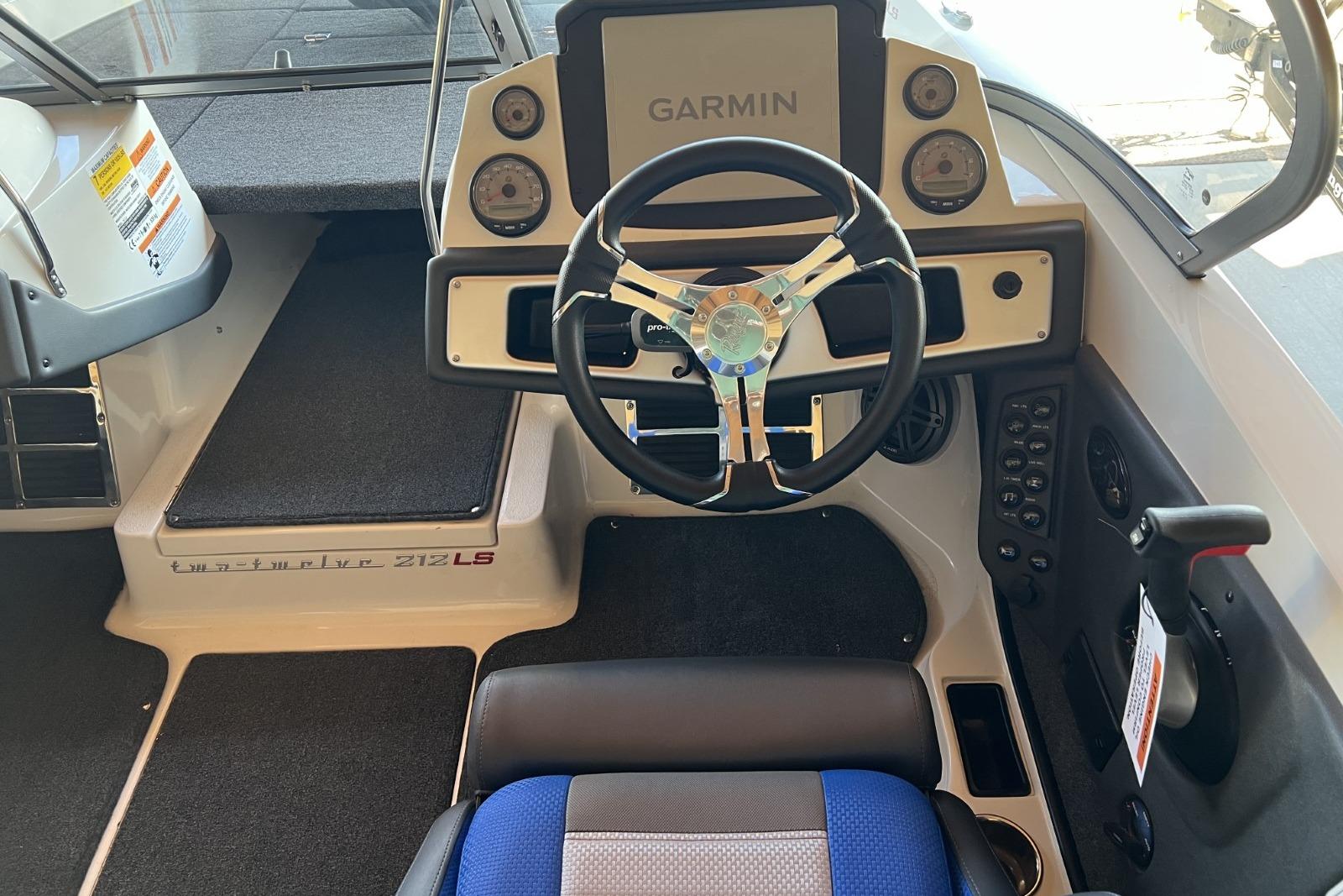 2025 Ranger 212LS boat cockpit with Garmin navigation and modern steering wheel.