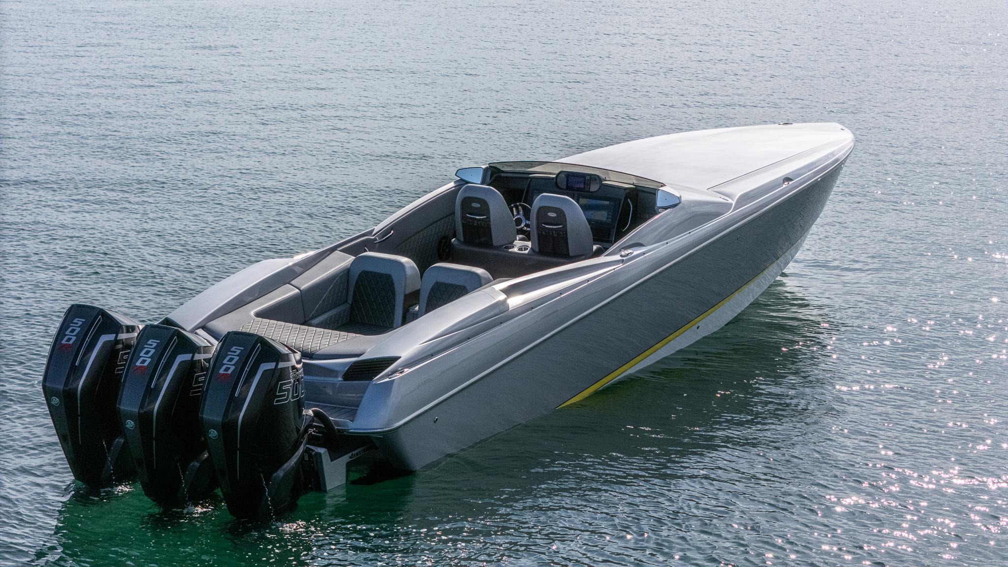 2017 Nor-Tech 3900 Super-VEE speedboat with triple outboard engines on calm water.