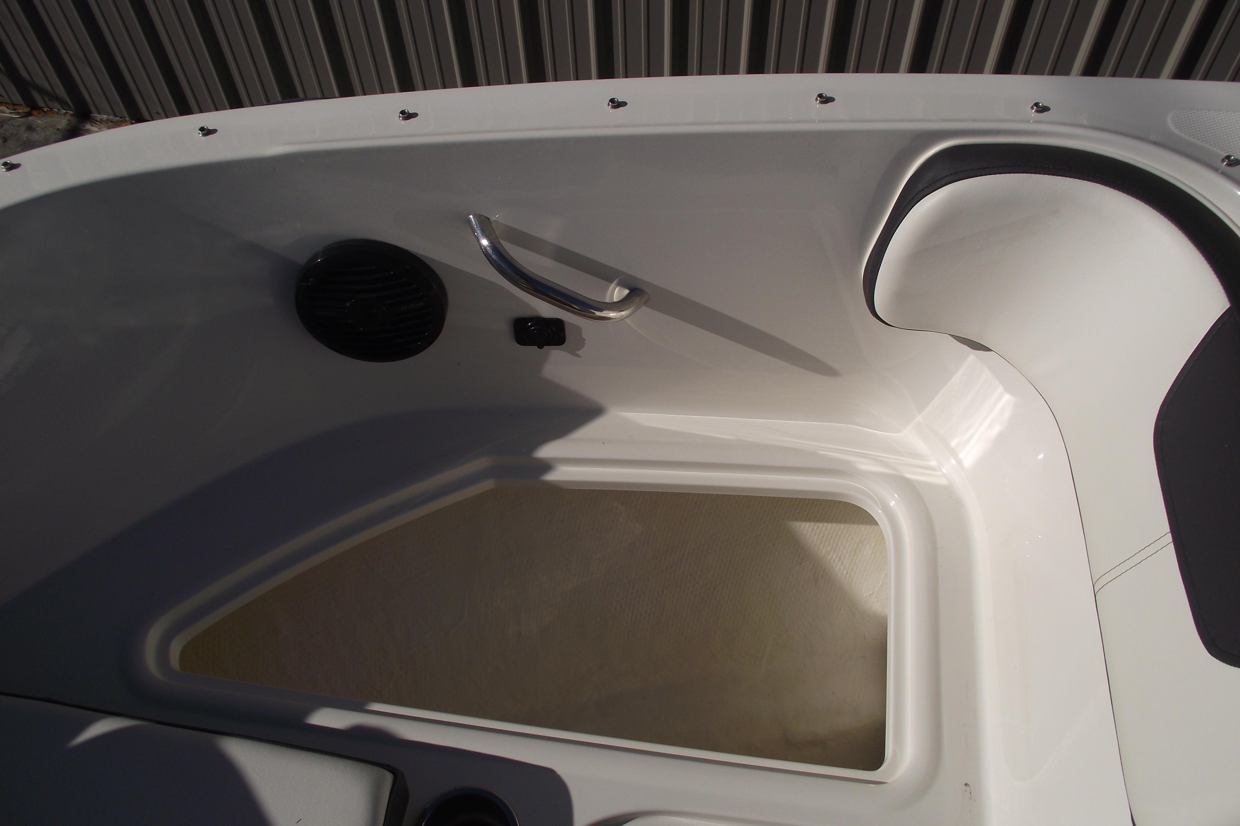 2022 Bayliner VR4 Bowrider OB interior detail with storage compartment and seating.