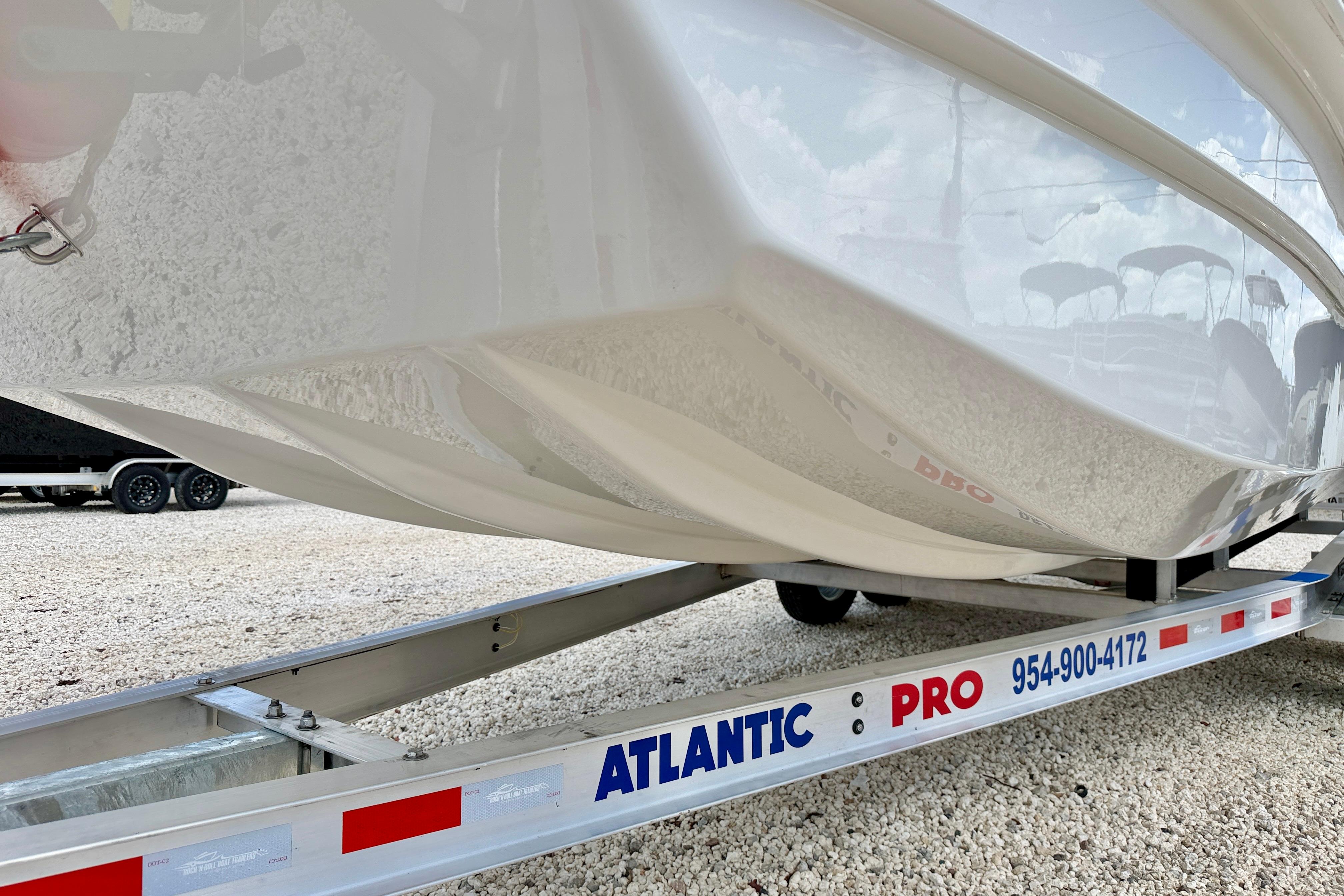 Bay Rider 2260 FS Skiff 2027 on Atlantic Pro trailer, showcasing sleek hull design.