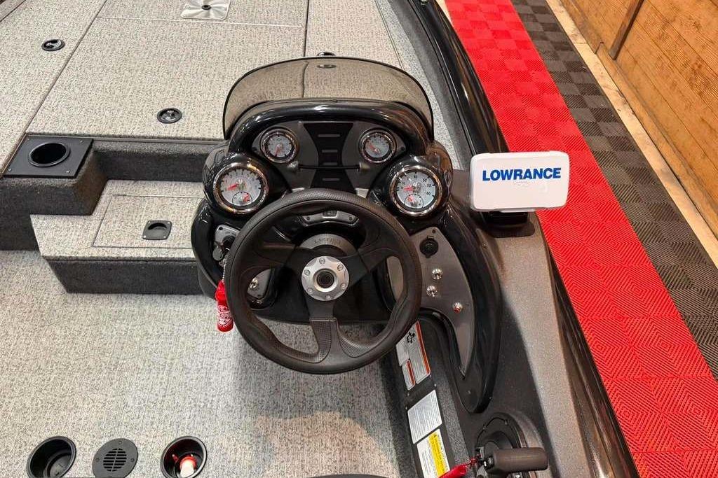 2024 Tracker Pro Team 175 boat dashboard with Lowrance electronics and steering wheel.