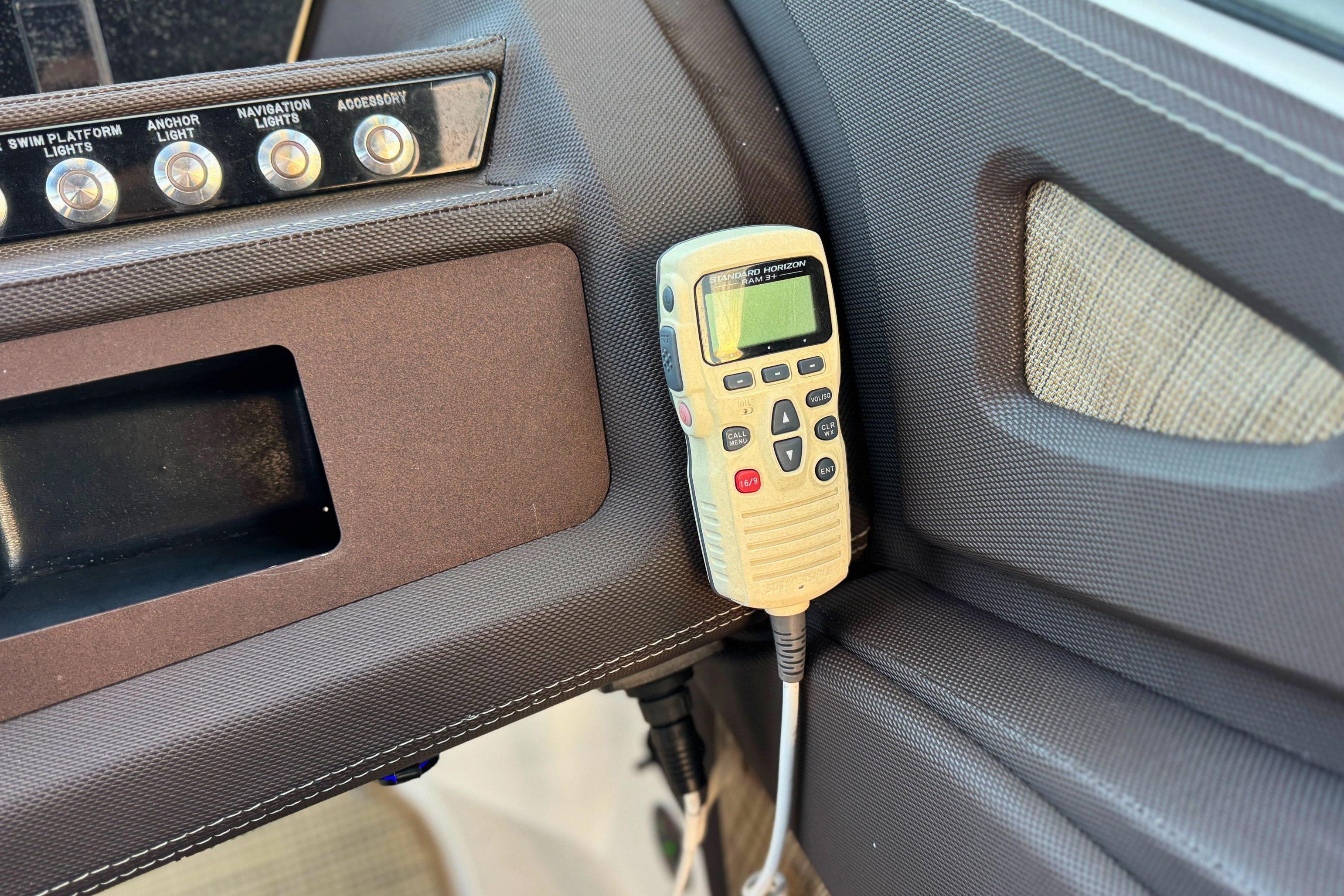 Control panel and radio in 2019 Cobalt R3 boat interior.