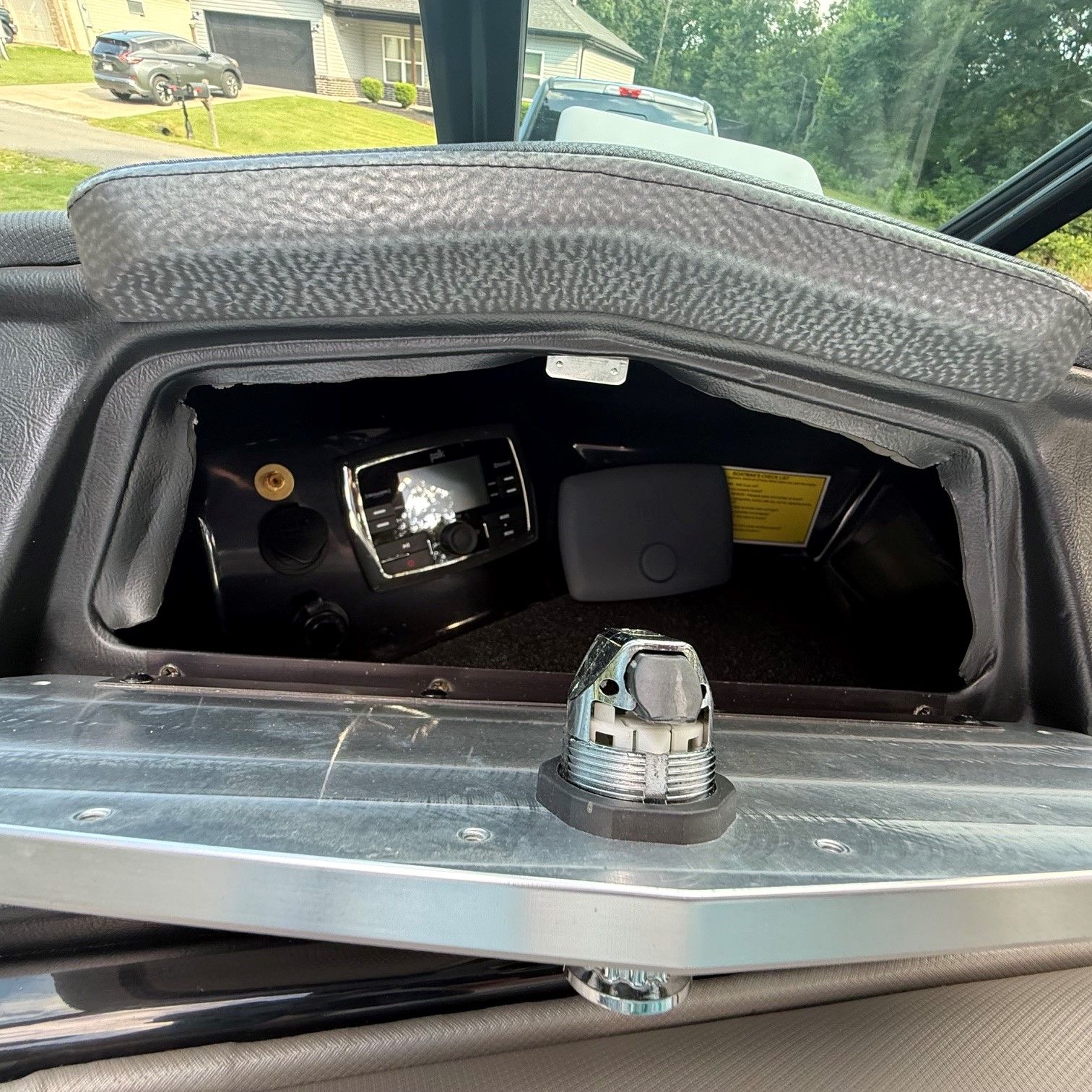 Interior view of a 2014 Supra SC350 with an open panel and visible controls.