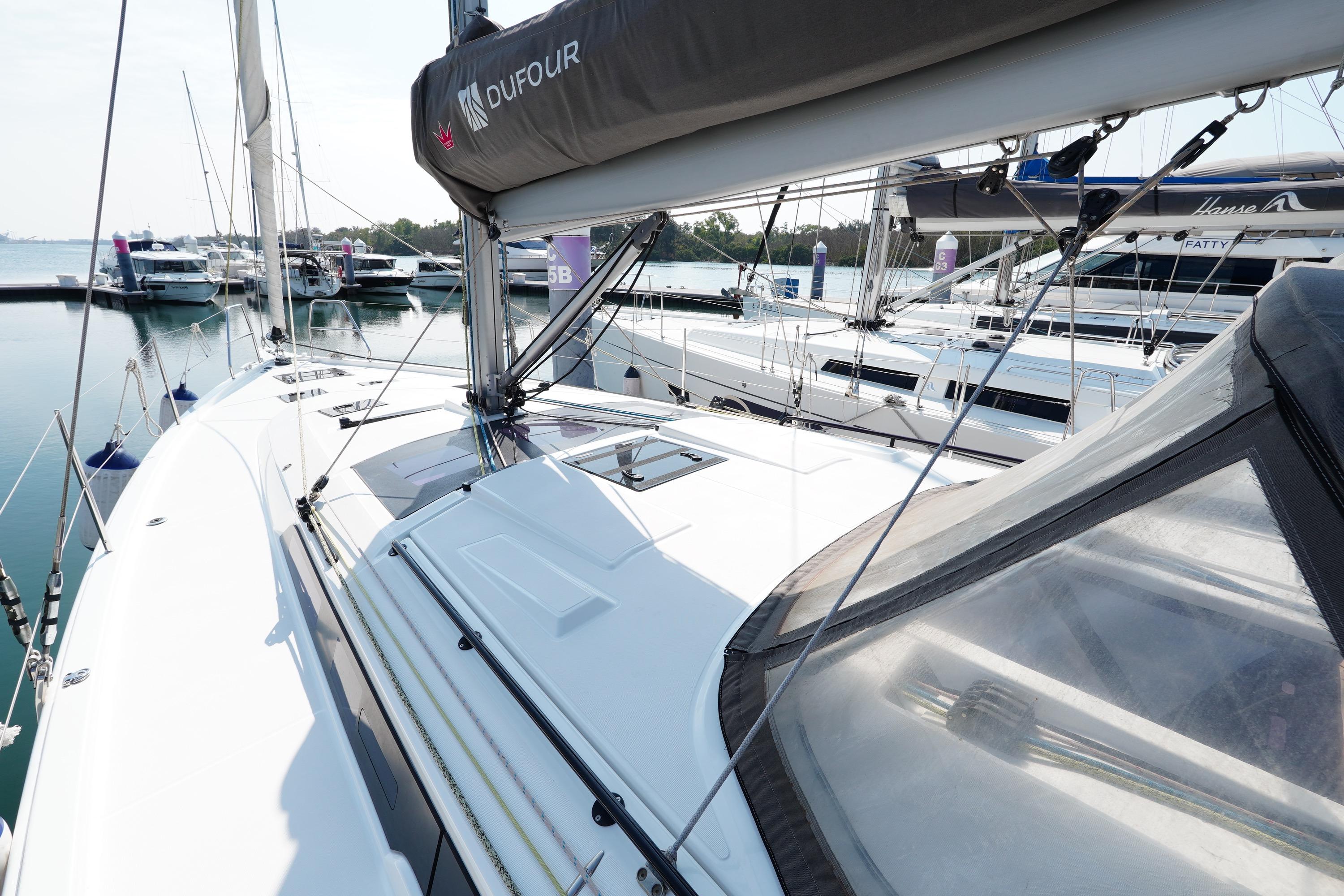 2023 Dufour D41 sailboat docked at marina, showcasing sleek design and modern features.