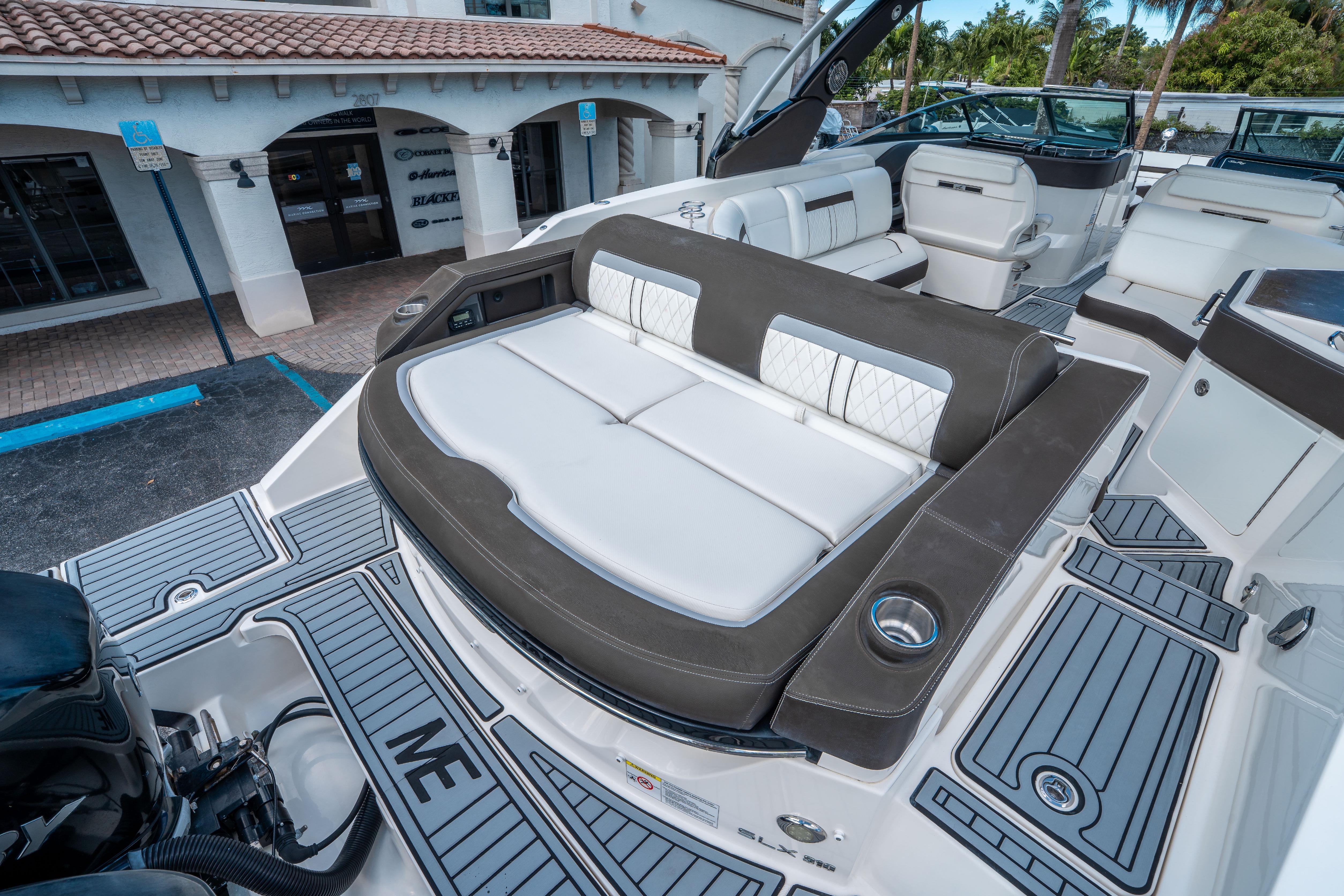 2018 Sea Ray SLX 310 boat with luxurious seating and modern design.