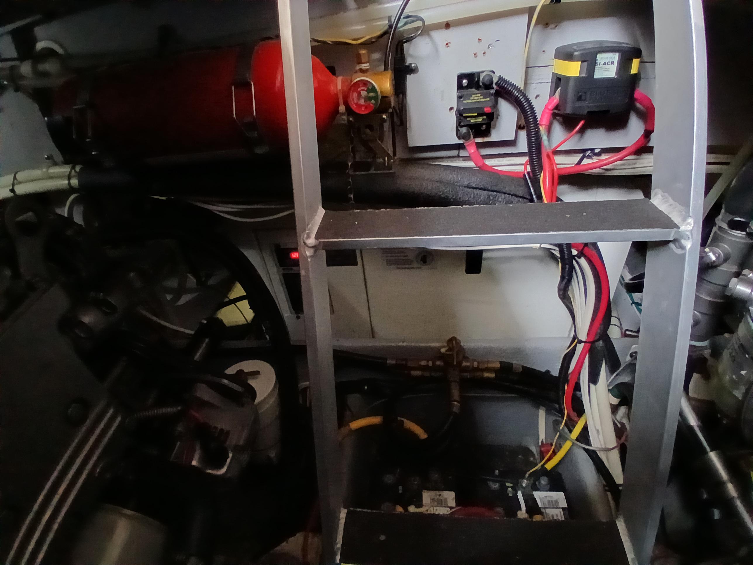 Engine room of 2006 Silverton 35 Motor Yacht with wiring and equipment.