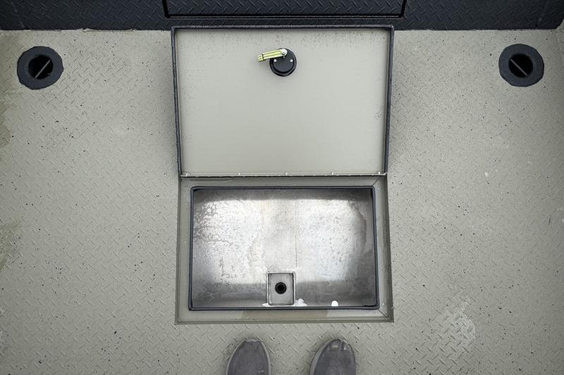 Open storage compartment on 2026 SeaArk Predator 300 AK boat deck.