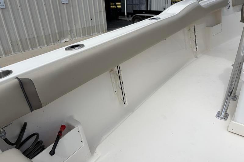 2024 Key West 239 FS boat interior, featuring sleek white design and rod holders.