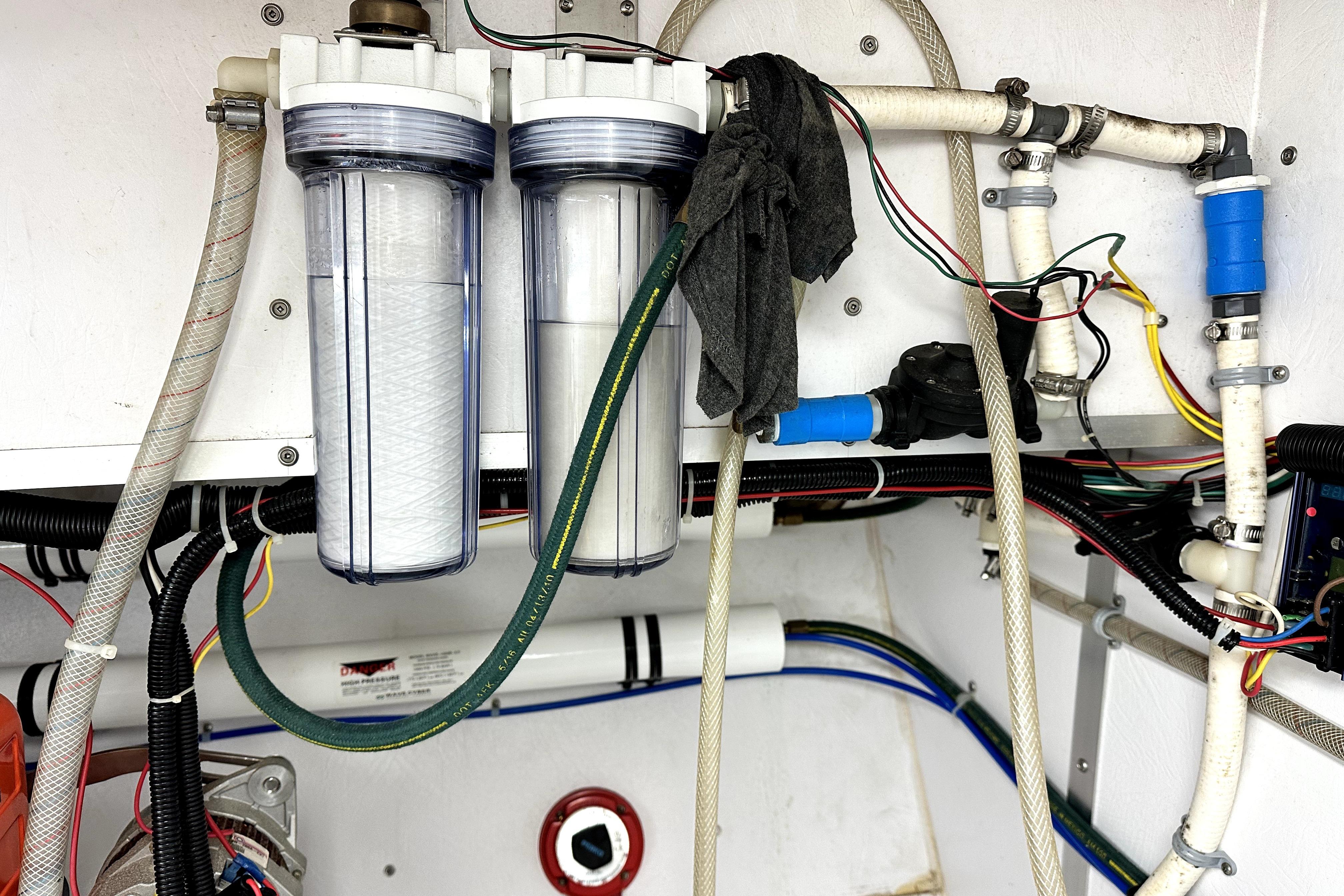 Engine room of a 2012 Custom Pacific Northwest 43 with water filtration system.