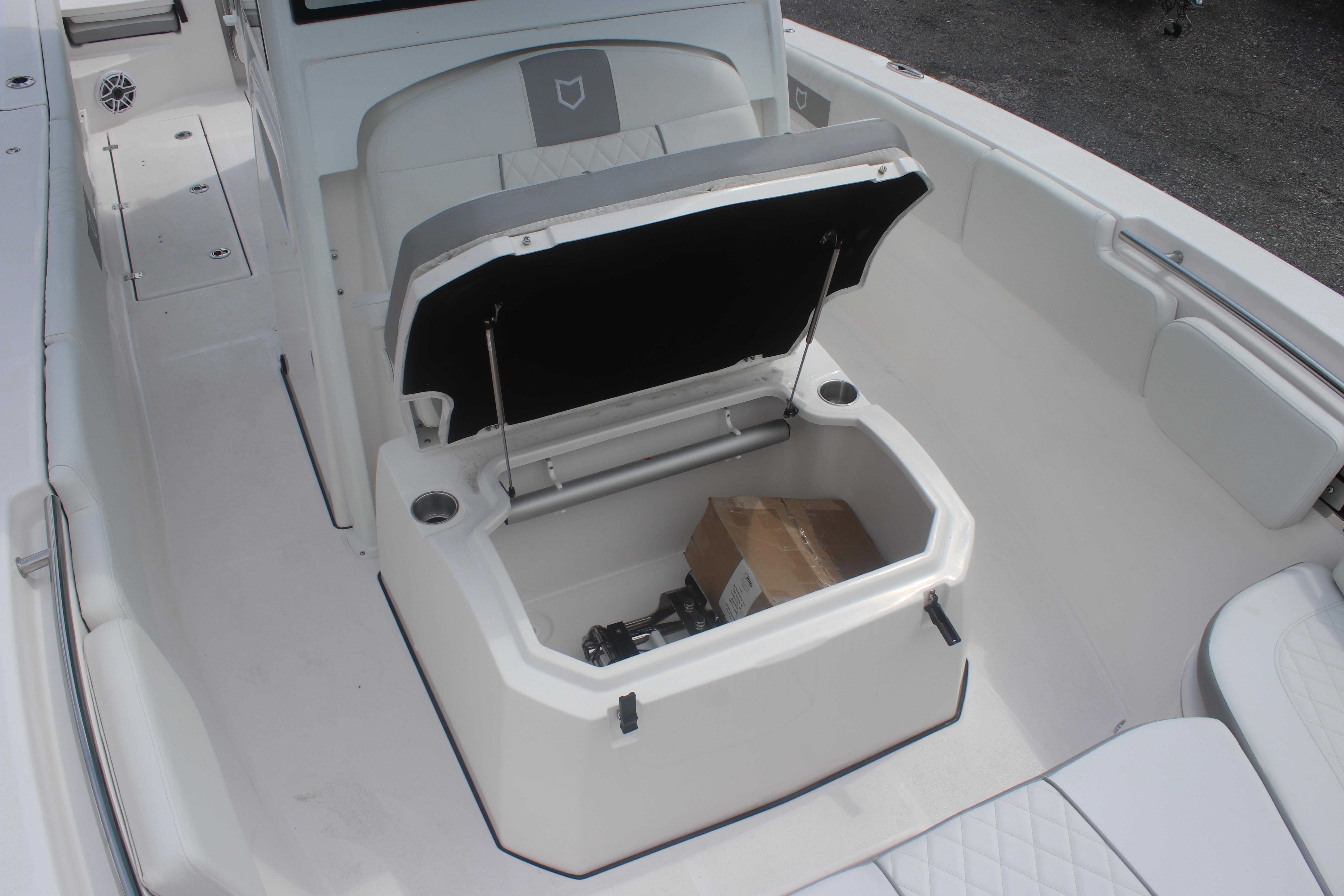 2026 Sea Fox 288 Commander boat with open storage compartment and seating area.