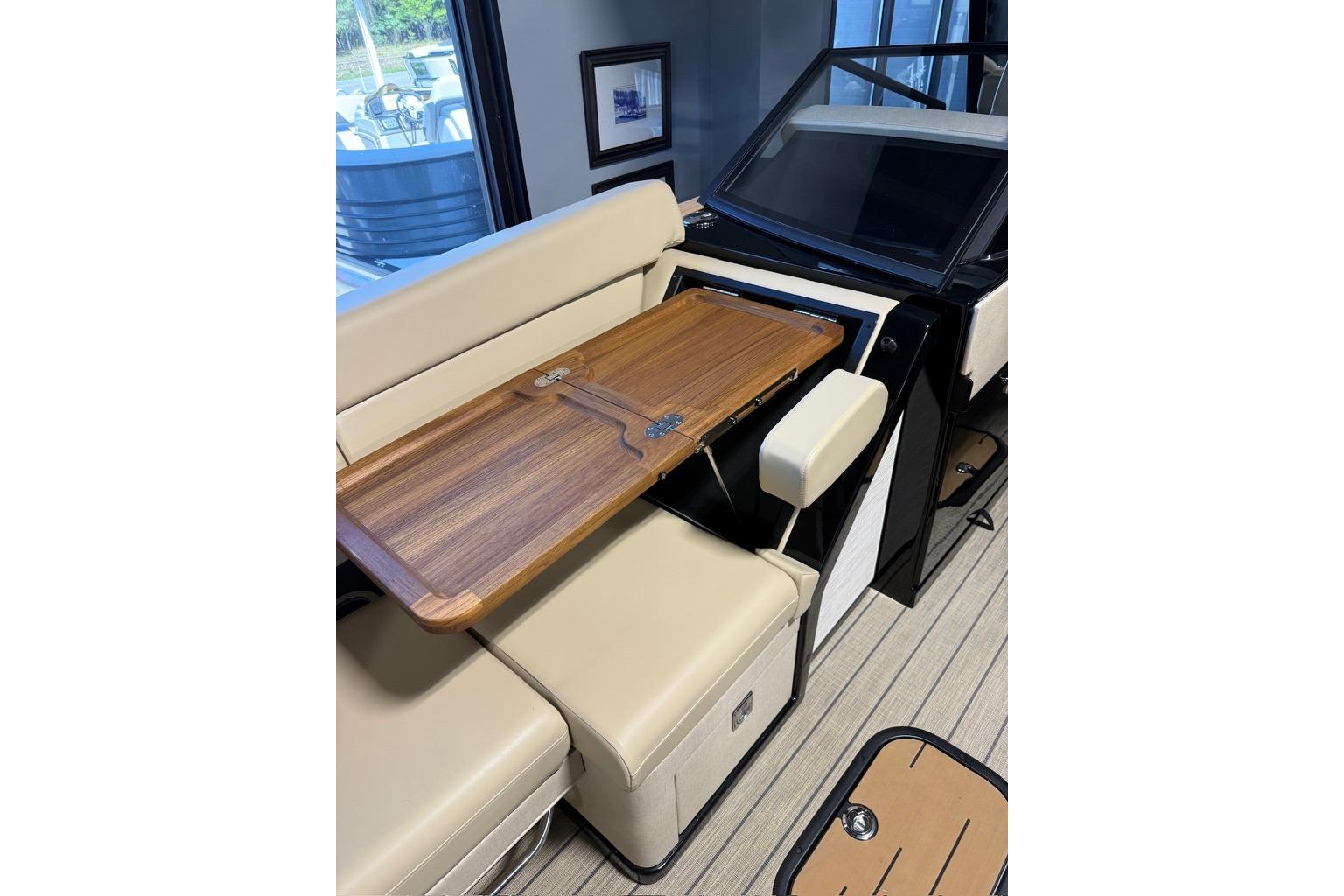 Luxurious interior of 2026 Balise Halo 26C Twin with foldable wooden table.