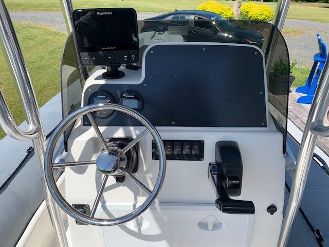 2017 Zodiac Pro Open 650 boat console with steering wheel and navigation system.